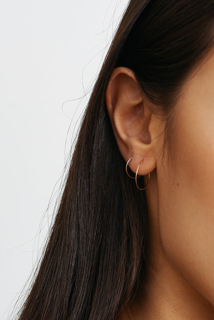Cropped view on model 14K 303 Mini Hoops Earrings paired with 302  Bagatiba