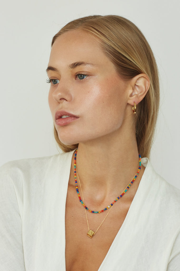 Model profile view wearing 14K Diamond Multi-Bead Necklace Necklace bagatiba