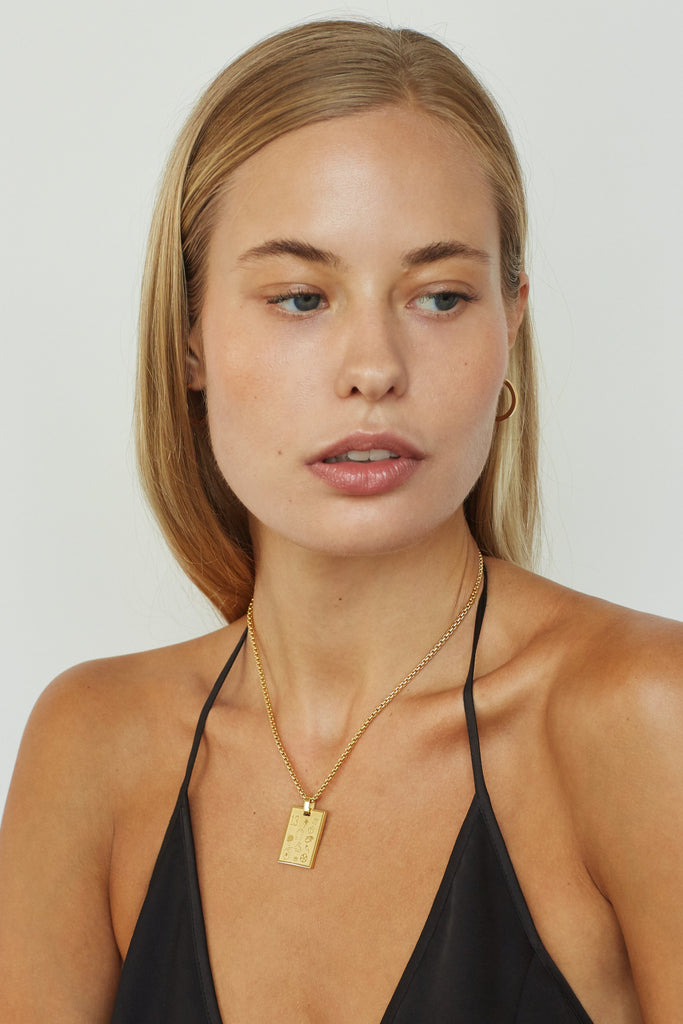 Model wearing 16" Snake Chain Necklace with Lucky Charm  bagatiba