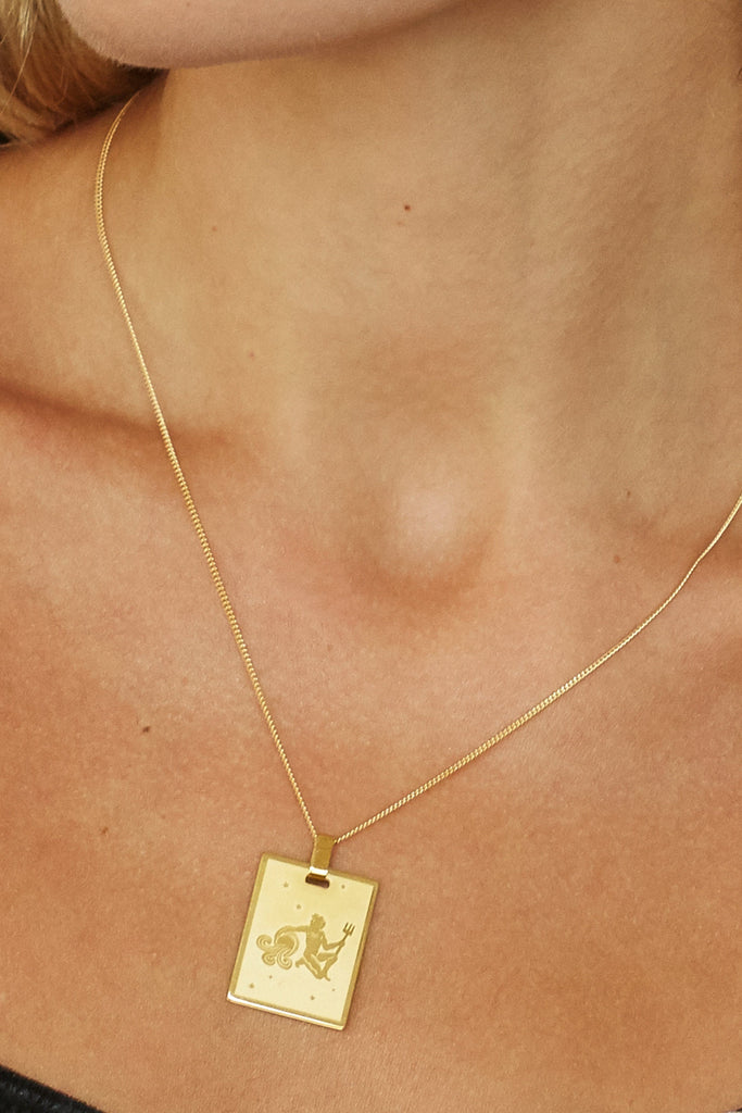 Cropped view on model of 18" Spiral Necklace with zodiac charm added  bagatiba
