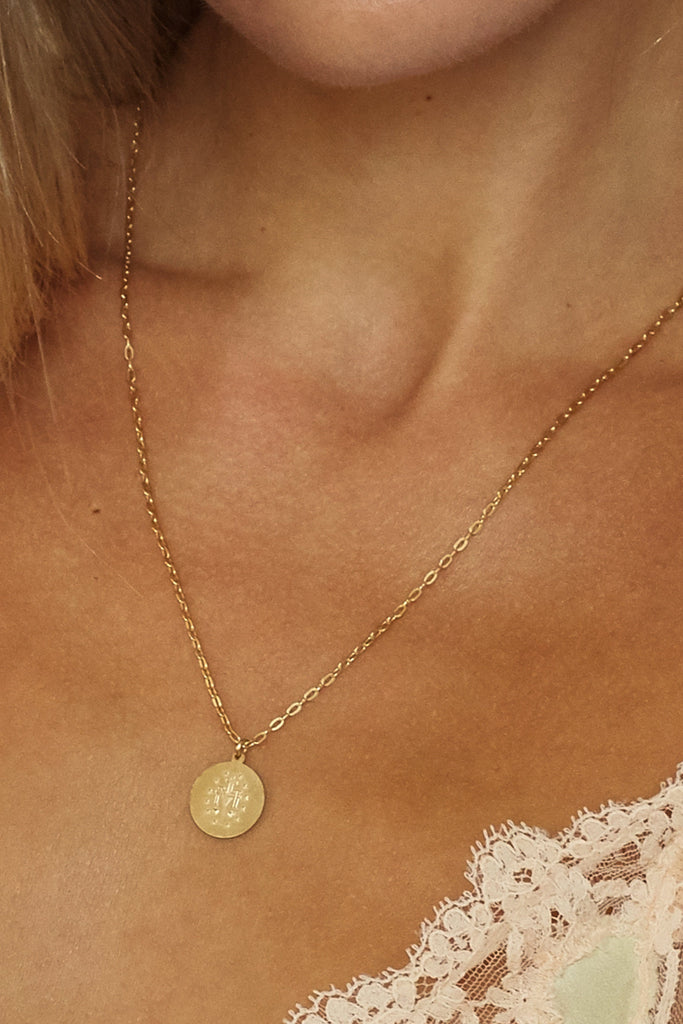 Cropped view on model reverse side 20" Pray For Mary Oval Necklace Necklace bagatiba