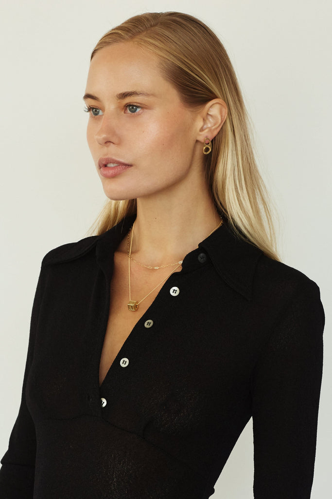 Model profile view wearing 26" Link Chain Necklace and letter block Necklace bagatiba