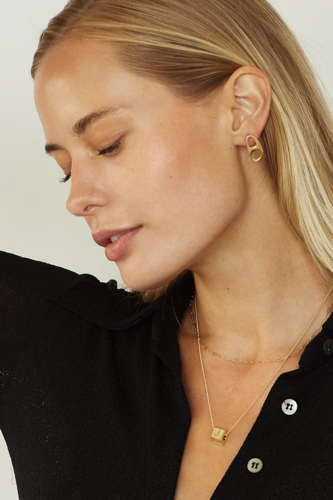 Model profile view of 26" Link Chain Necklace layered with another Necklace and Gold Tab Studs  bagatiba