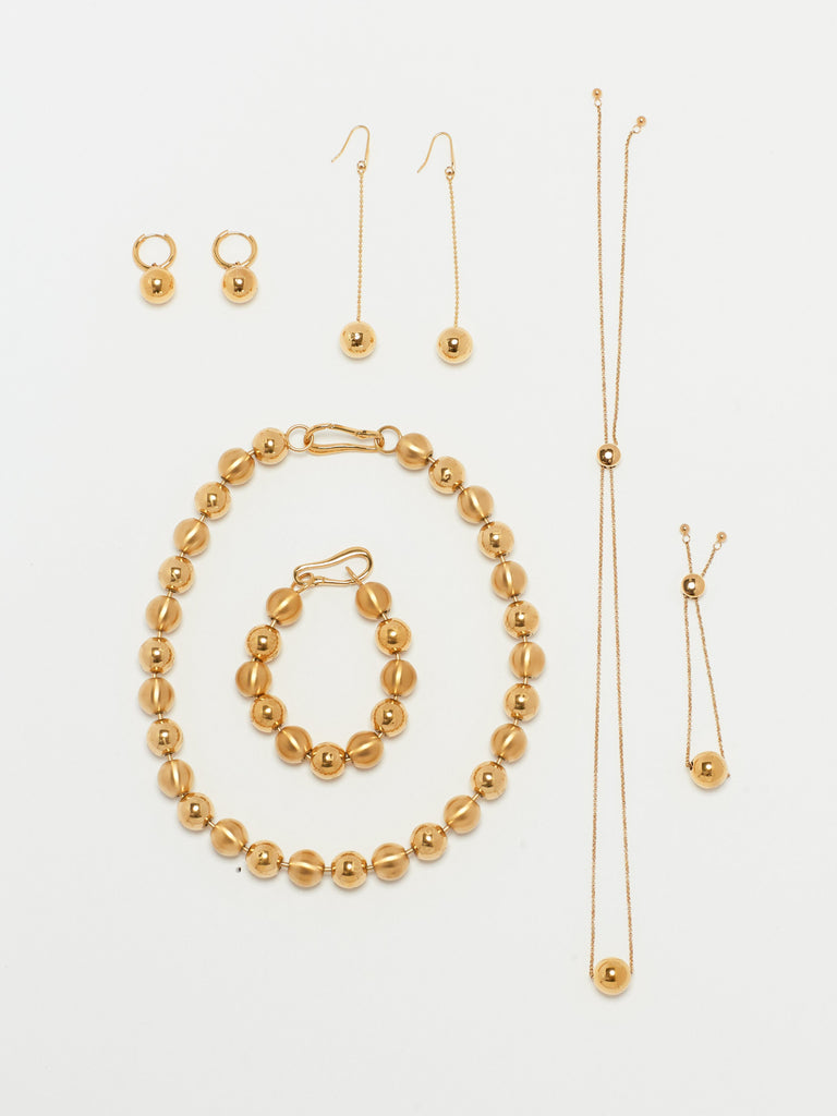 Full view flat lay of Adjustable Sphere Necklace and collection  bagatiba