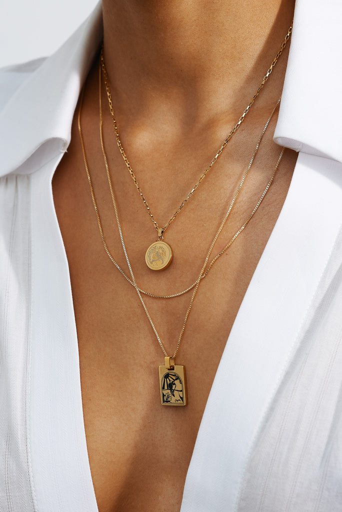 Cropped view of model's neck wearing Bagatiba Long Cage Necklace Necklace Bagatiba