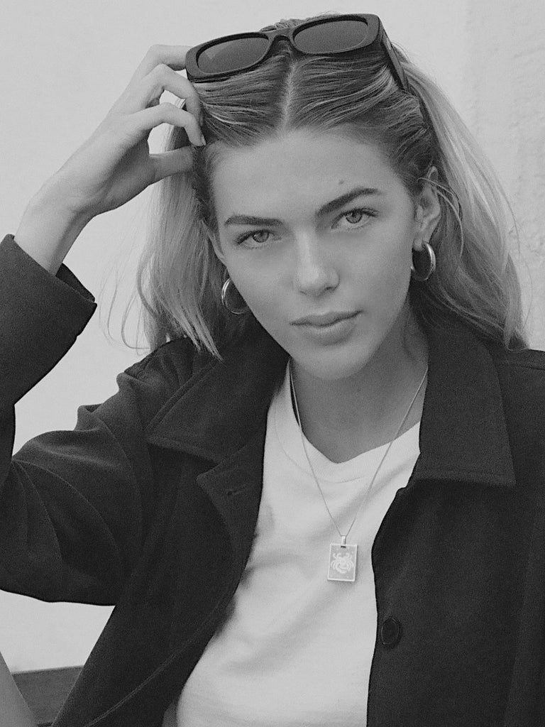 black and white photo of model in Cancer Charm charm Bagatiba