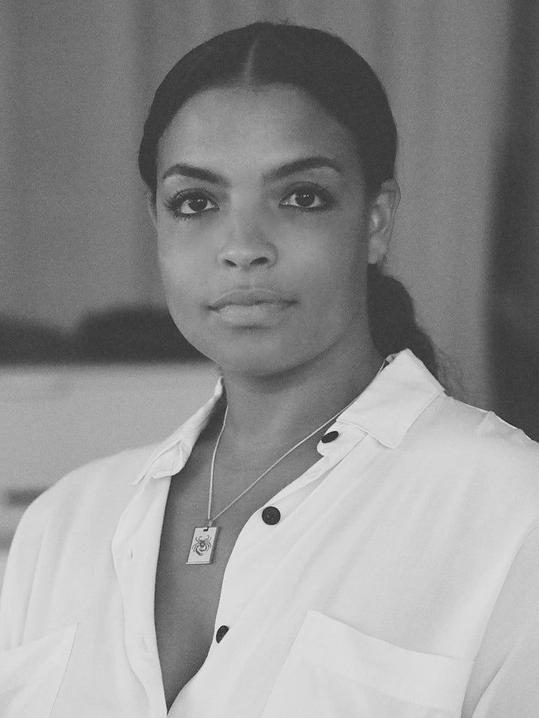 Black and White photo of model wearing Cancer Charm charm Bagatiba