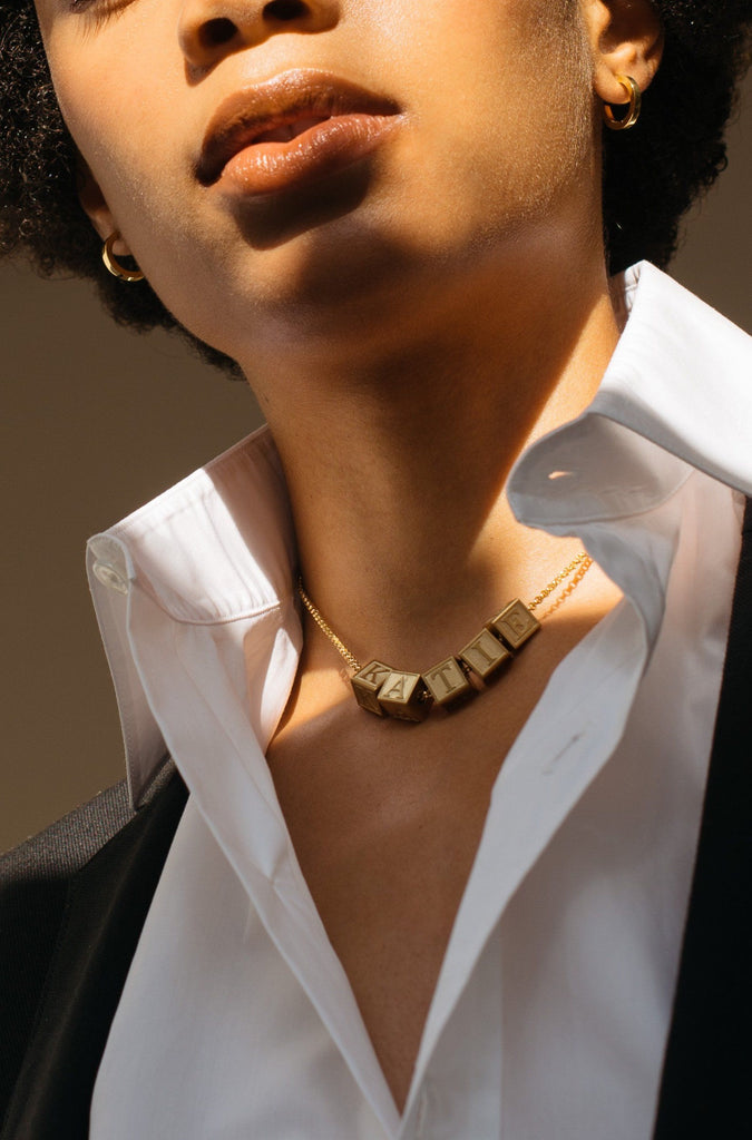 Model wearing 5 Letter Block letters on chain Bagatiba