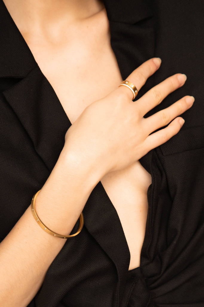 Cropped view of Model's hand and torso wearing Diamond Ring, Gemma Ring and Gemma Bracelet  Bagatiba