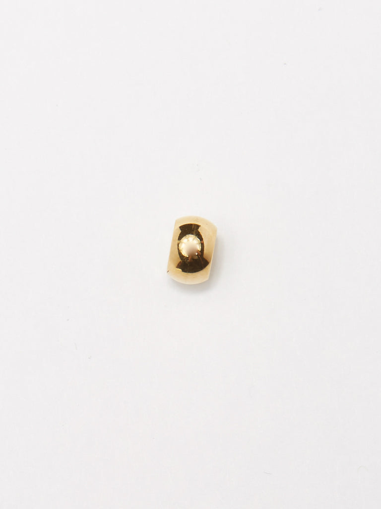 Detail flat lay of the bead from Gold Bead Set Bagatiba