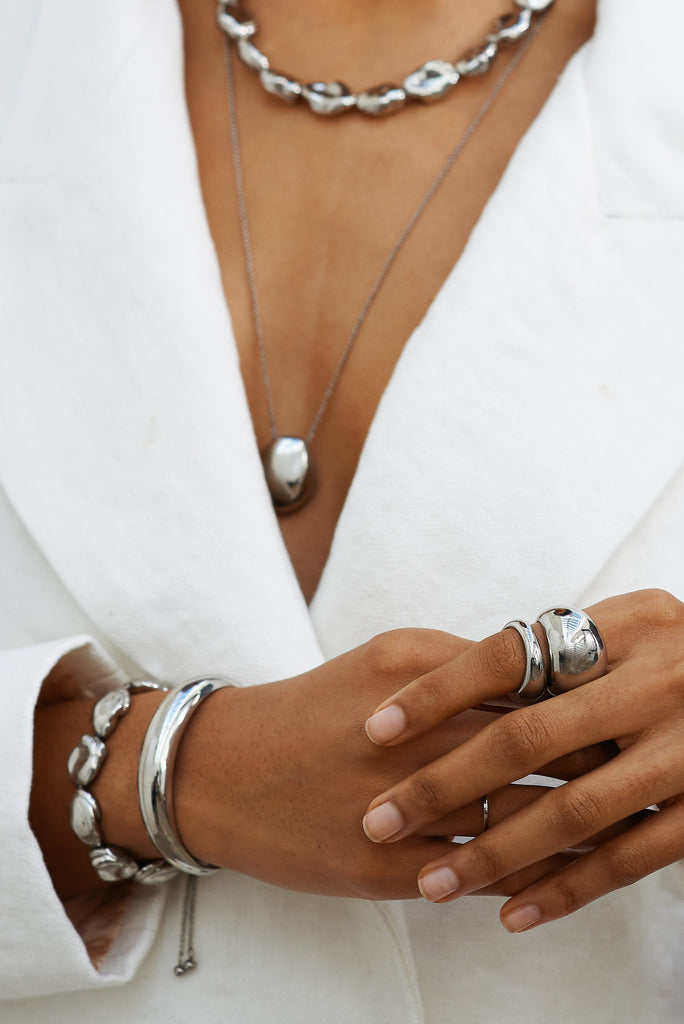 Cropped view on model of Large Silver Orb Ring Ring bagatiba