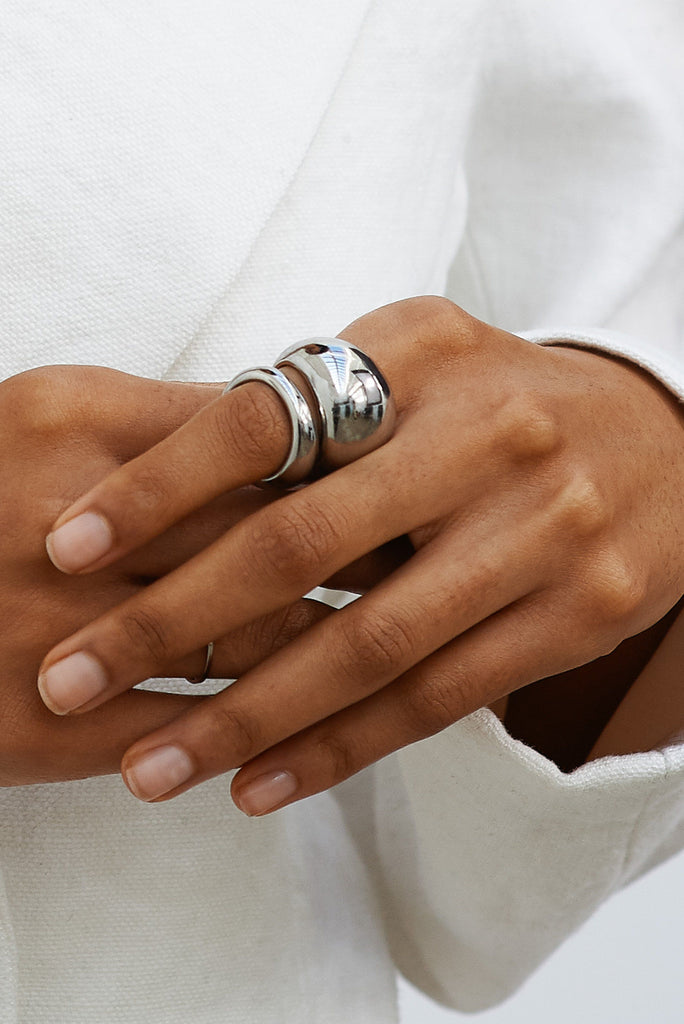 Close view of hand with Large Silver Orb Ring Ring bagatiba