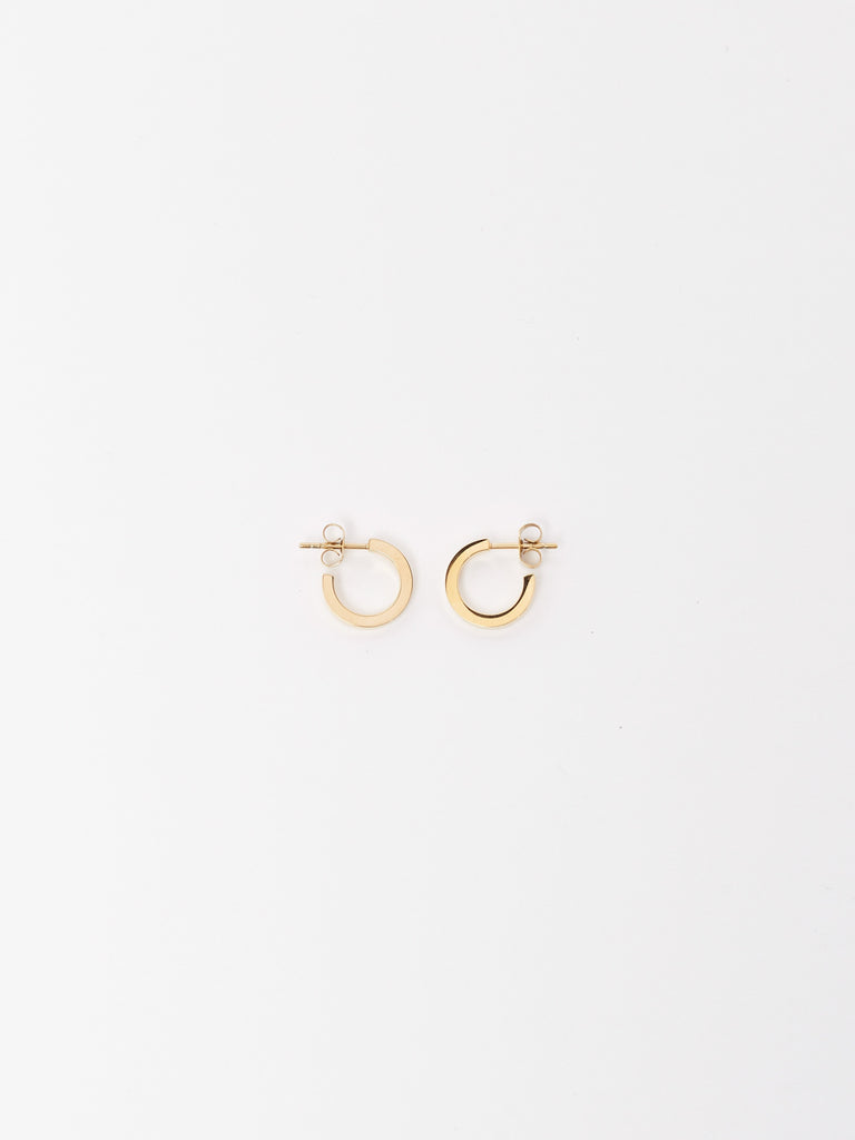 Flat lay of Mini Simple Gold Hoops Earrings Bagatiba