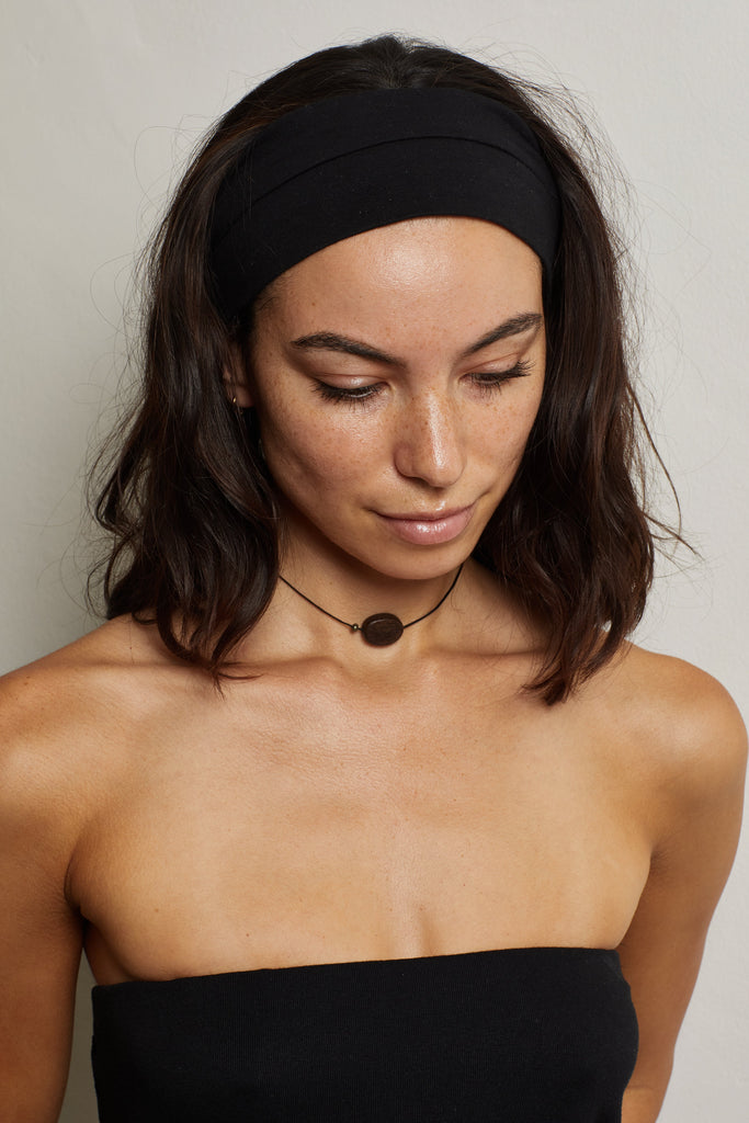 Oval Wood Bead Necklace necklace on model distant portrait in necklace