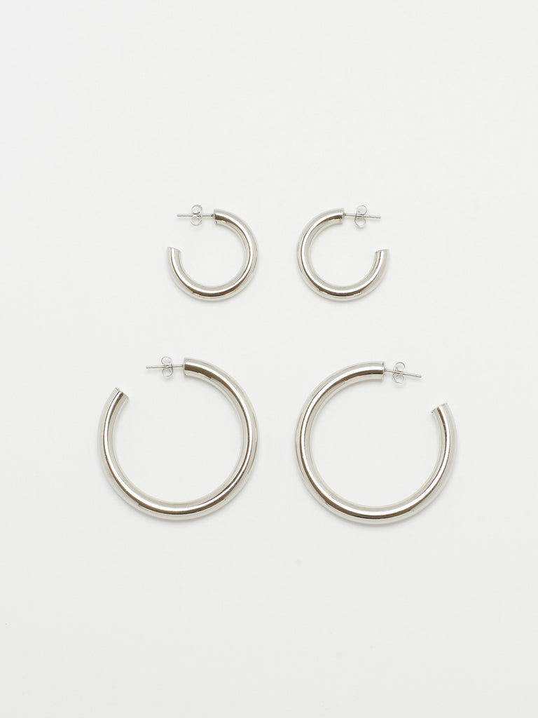 Full view flat lay of Silver Hollow Hoops and Mini Silver Hollow Hoops Earrings Bagatiba