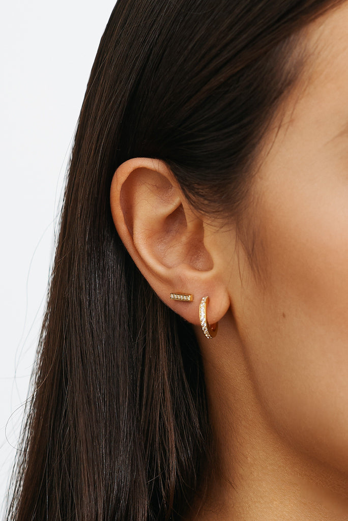 Cropped view on model's ear of Small Diamond Hoops Earrings Bagatiba