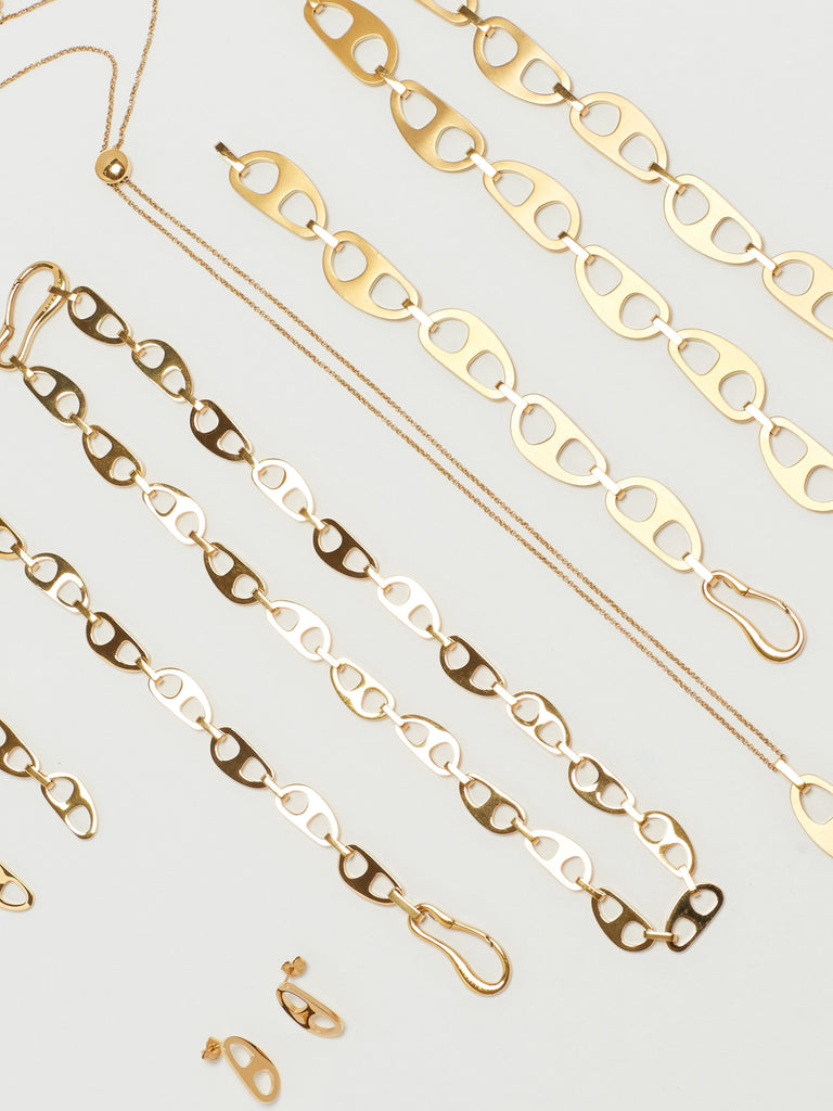 Detail view flat lay of the Gold Tab Collection by bagatiba