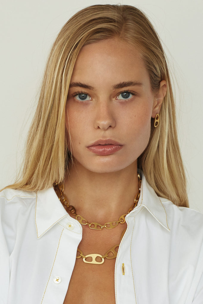 Model profile view wearing the Small Gold Tab Necklace Necklace bagatiba