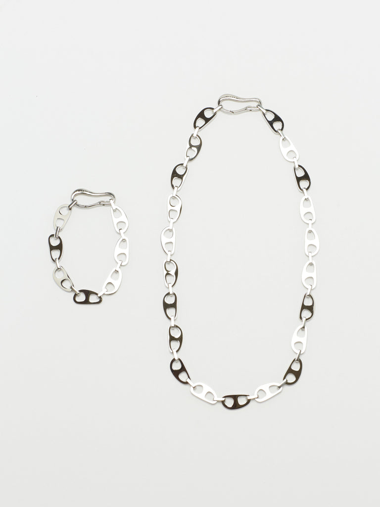 Full view flat lay of Small Silver Tab Necklace and Bracelet by bagatiba
