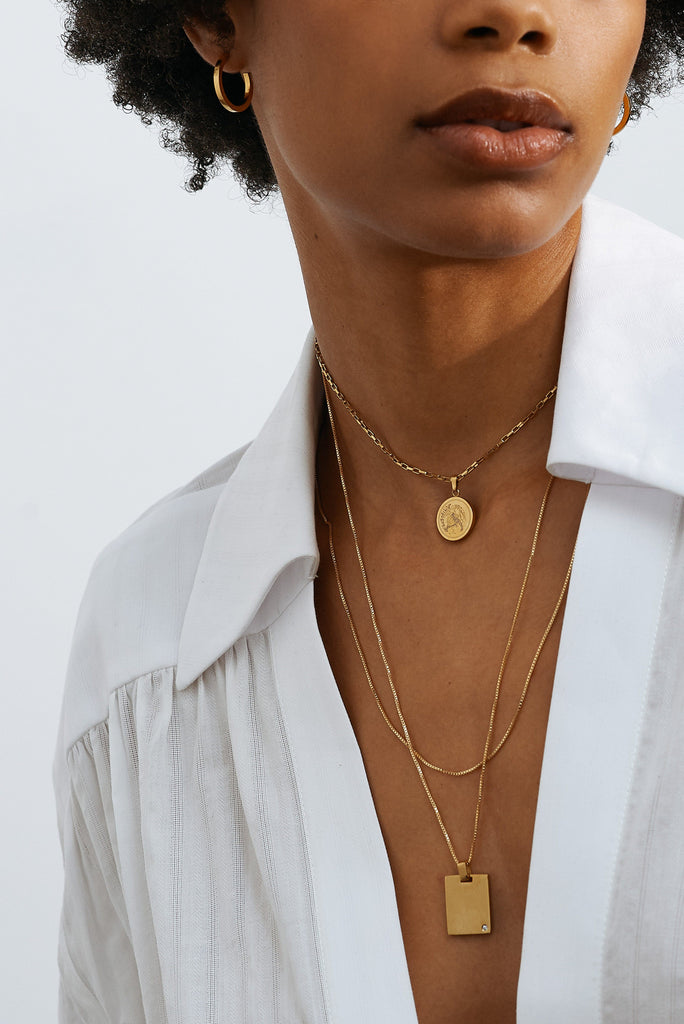 Cropped view of model in the Tiger Charm Necklace Necklace Bagatiba