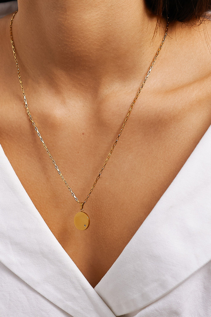 Cropped view on model of the Tiger Charm Necklace by Bagatiba