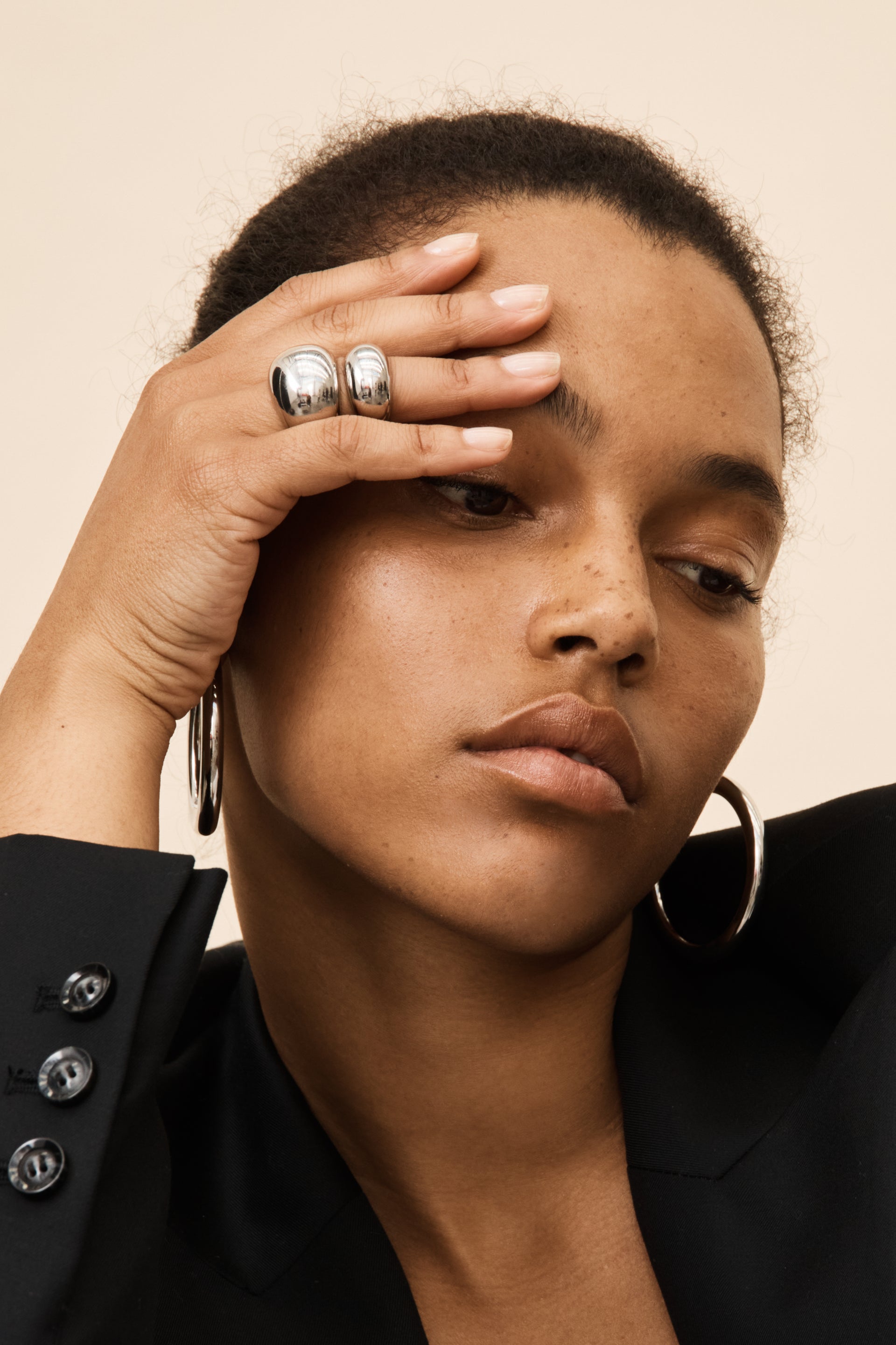 eco silver rings and hoops on model
