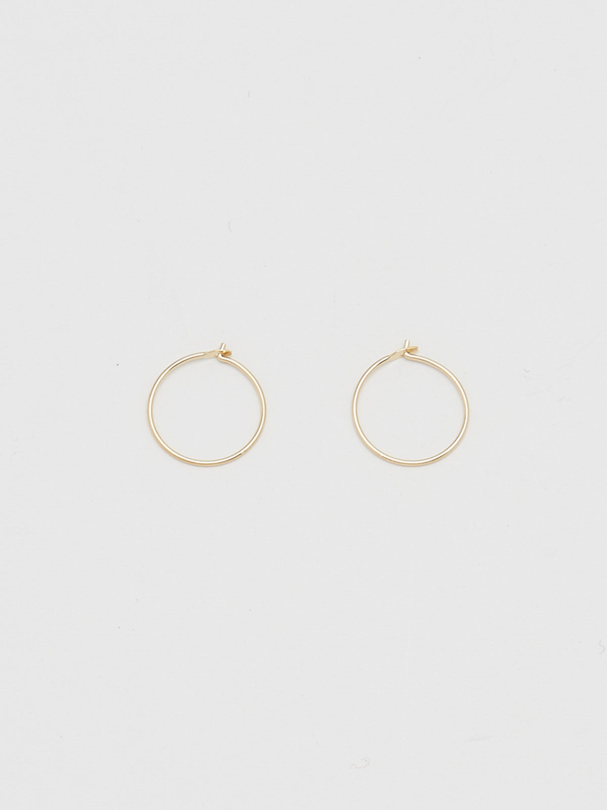Close view flat lay 14K 301 Mini Hoops Earrings Bagatiba 