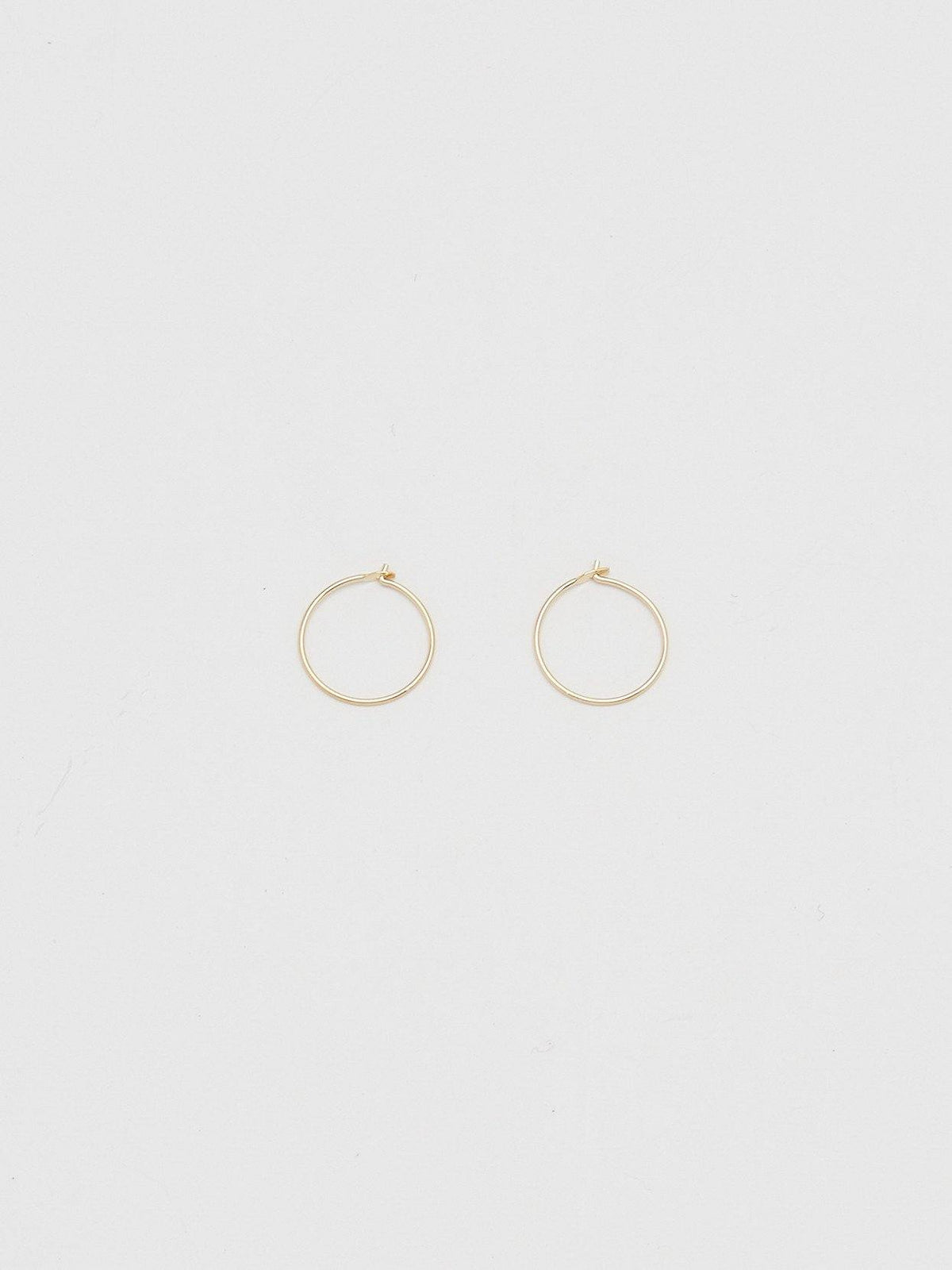 Full view flat lay of 14K 302 Mini Hoops Earrings Bagatiba 