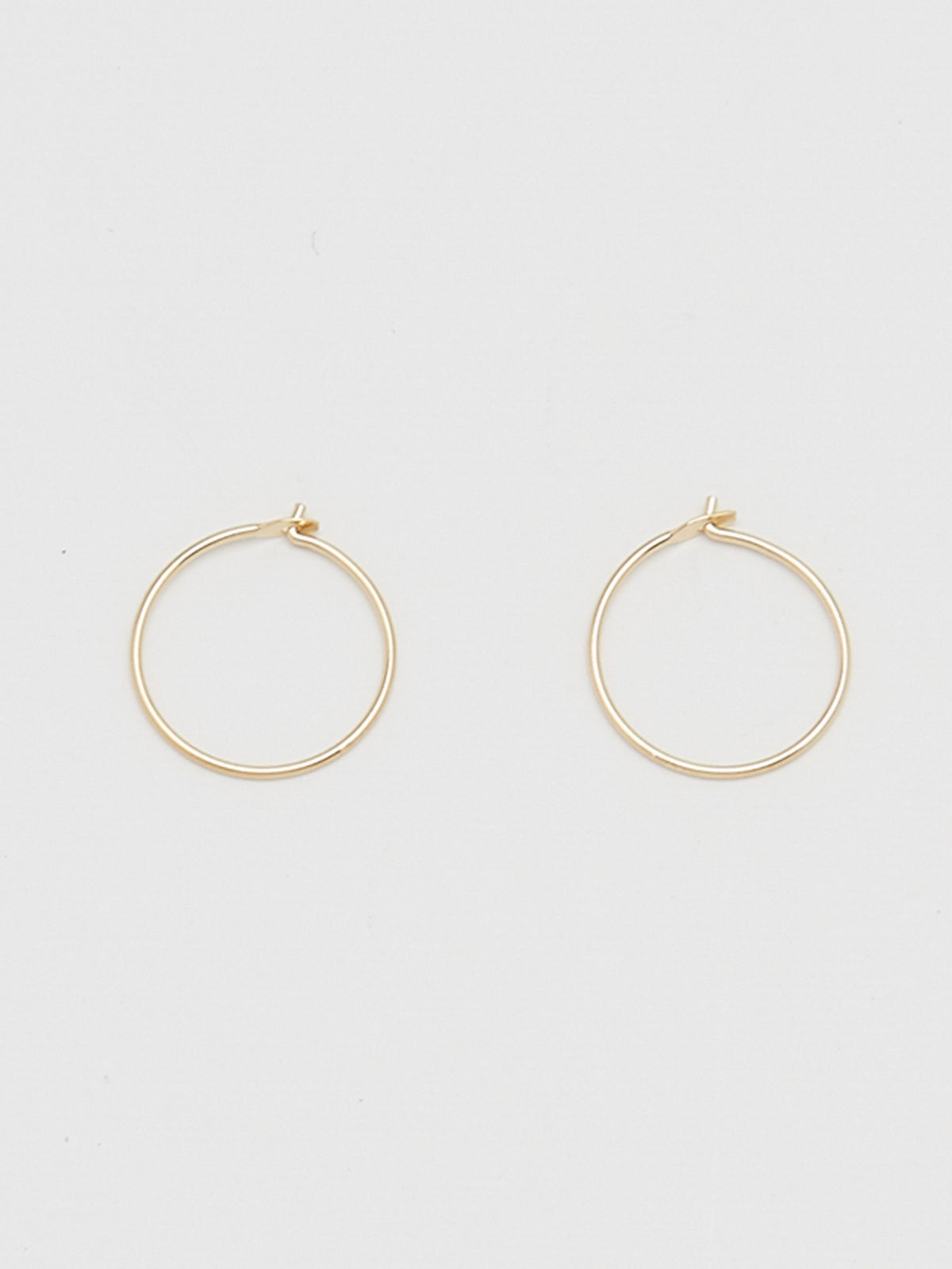 Close view flay lay of 14K 303 Mini Hoops Earrings Bagatiba 