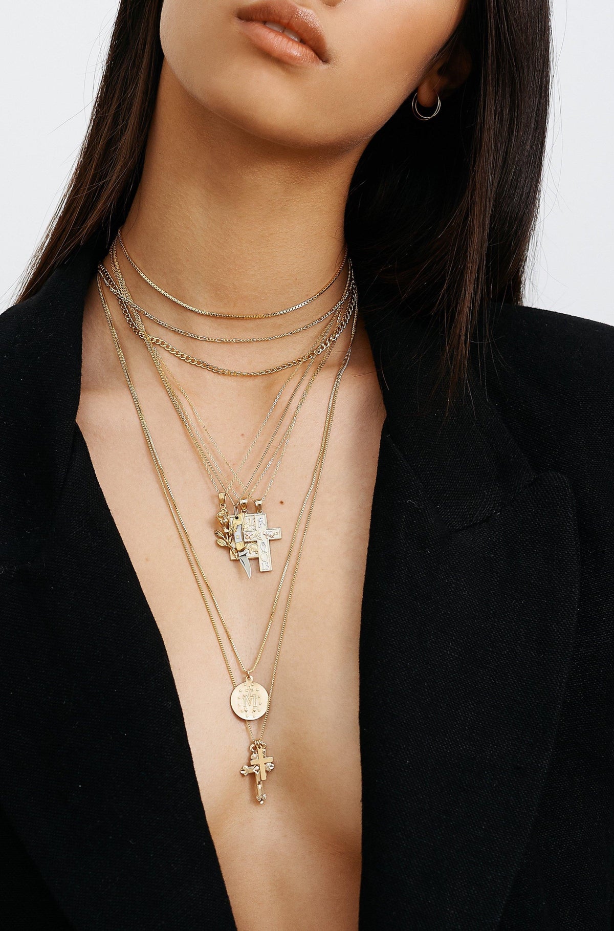 Full view of model wearing 14K 303 Mini Hoops Earrings paired with 8 necklaces  Bagatiba 