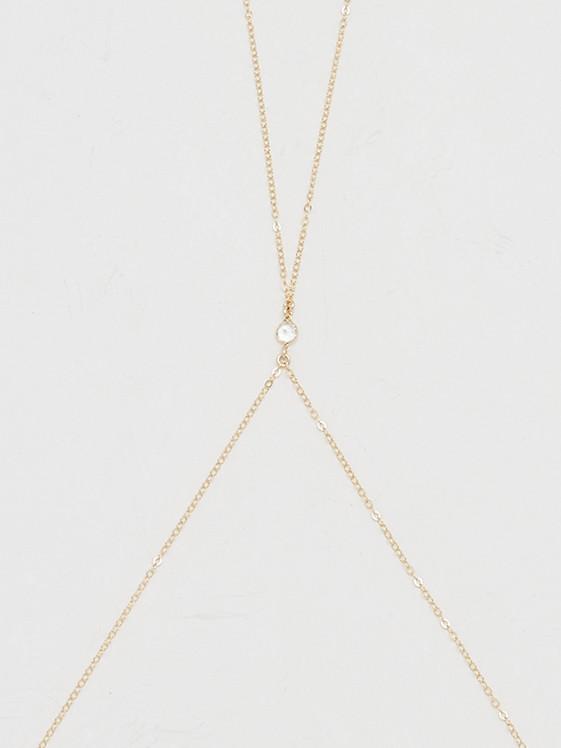 Cropped view flat lay of 14K Emma Body Chain Body Bagatiba 