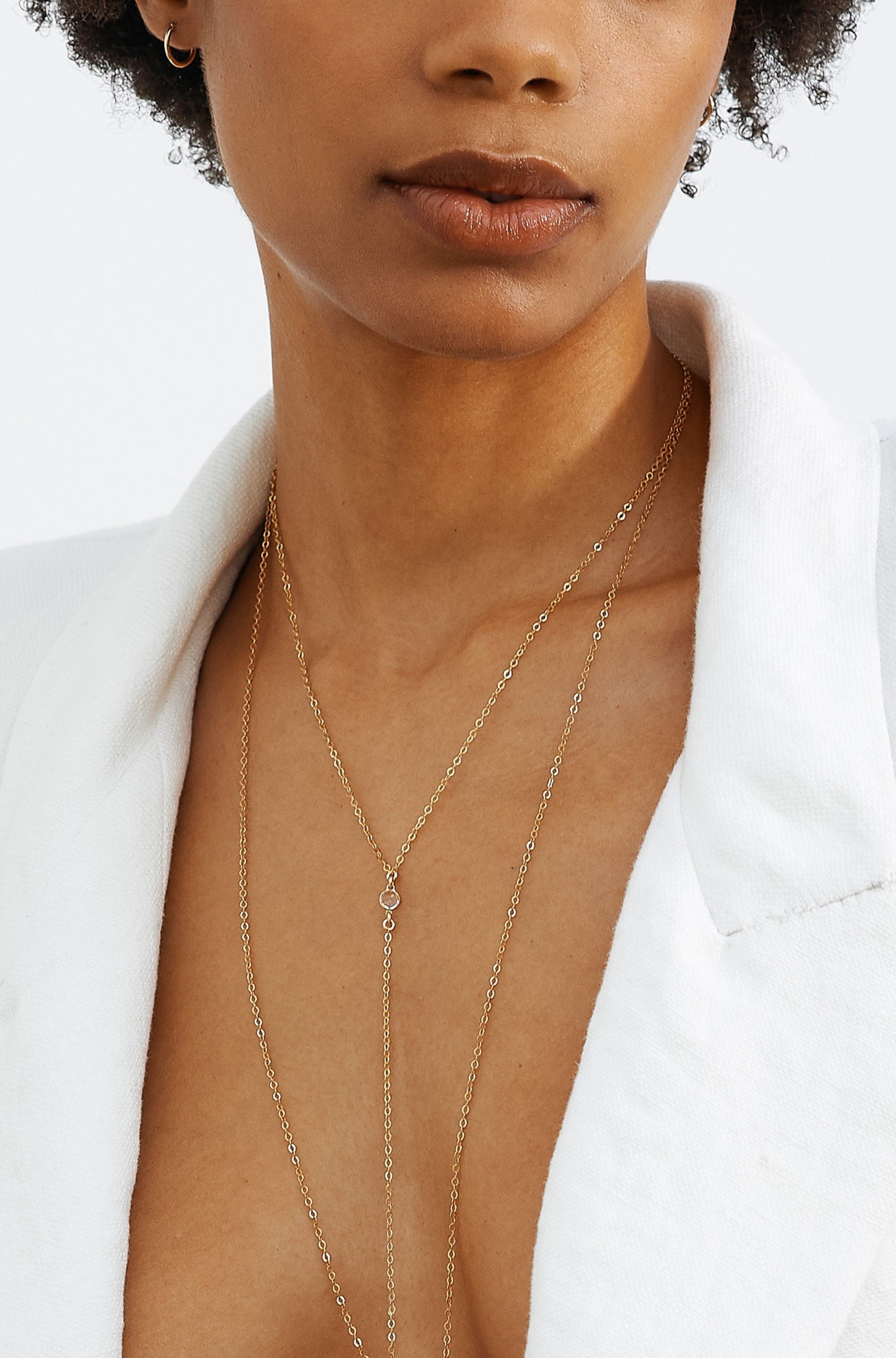 Model wearing 14K Emma Drop Necklace layered with Necklace Bagatiba 