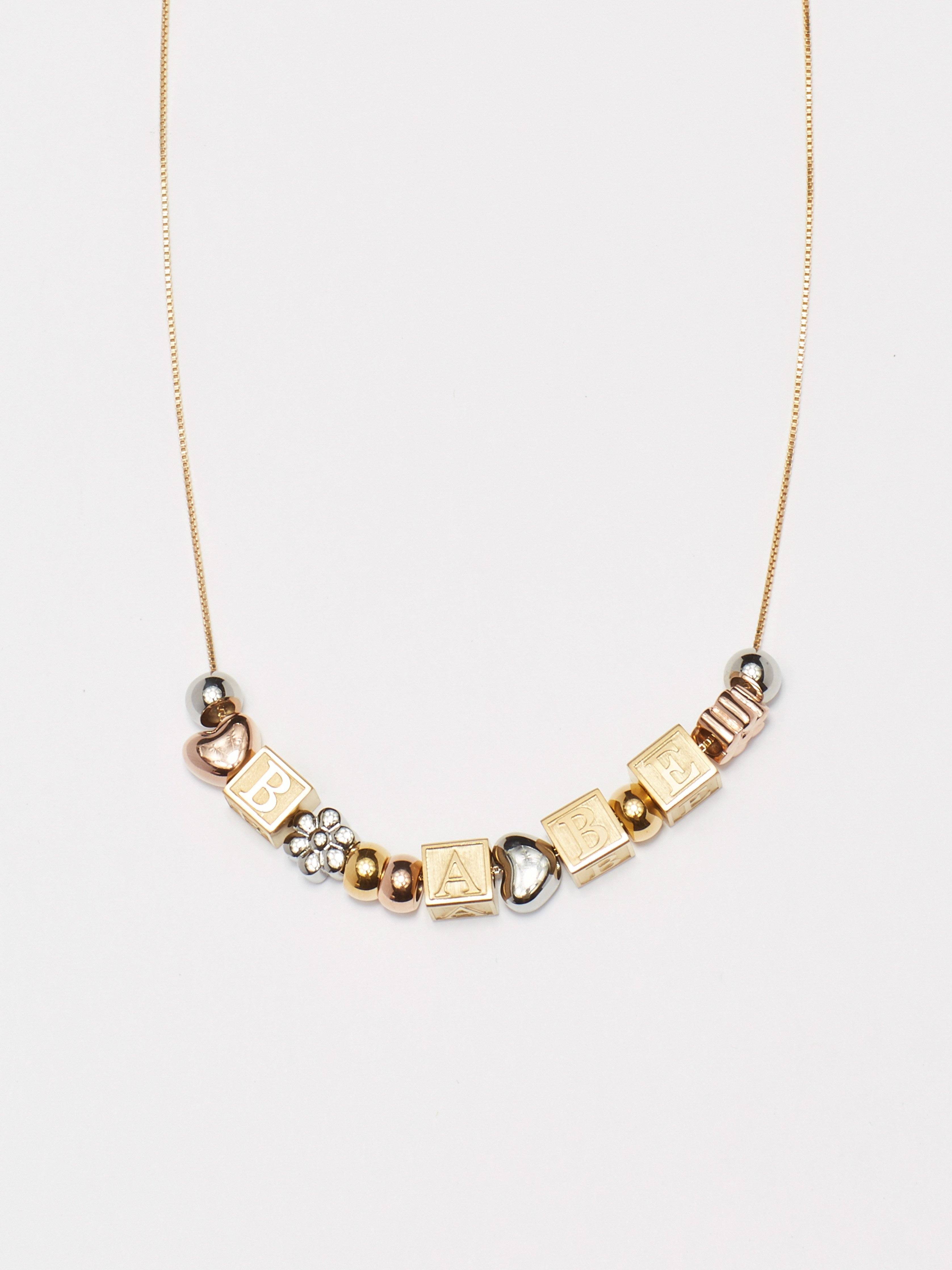 close up flat lay of "A" Letter Block letters on chain with mixed beads & 3 additional letter blocks Bagatiba 