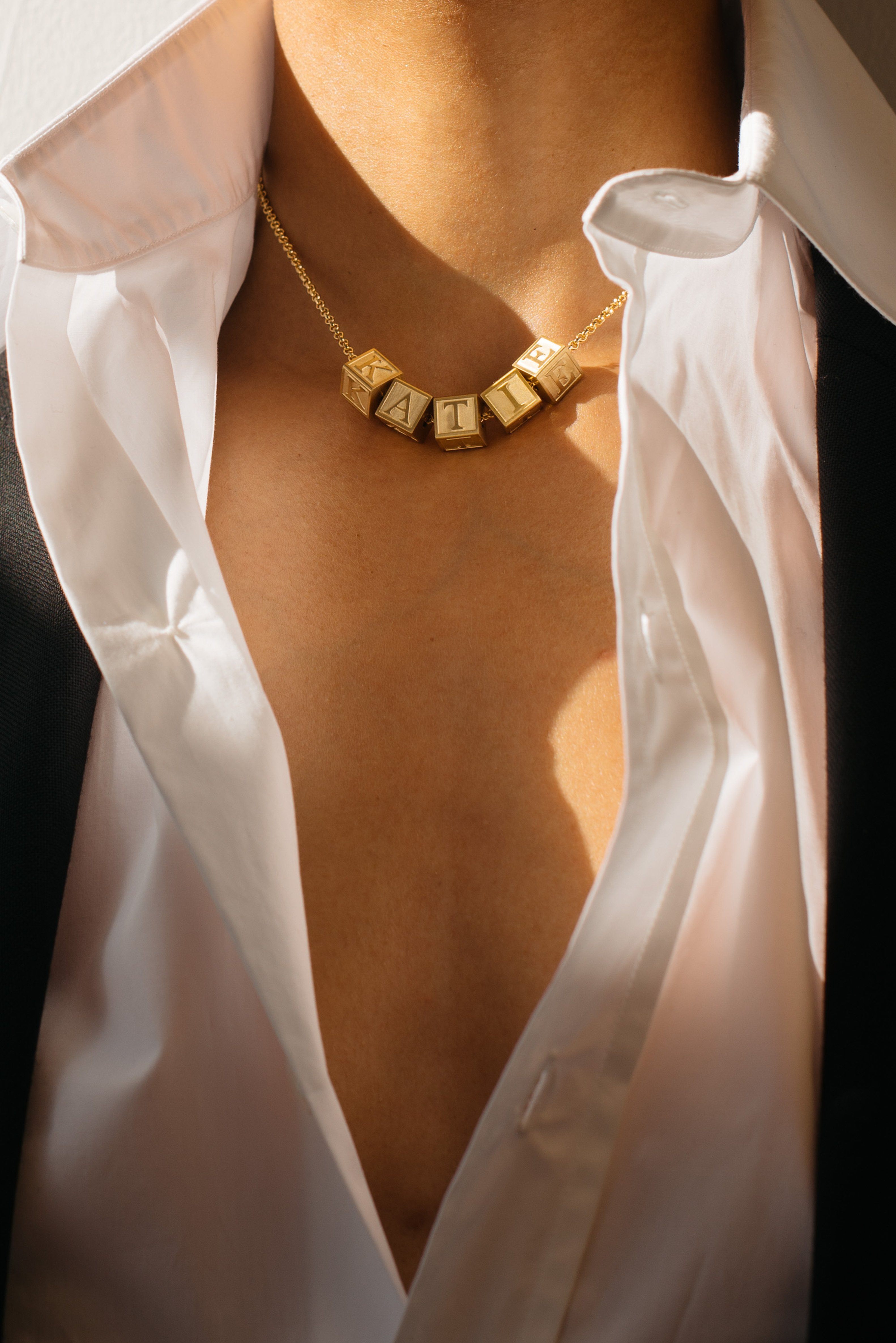 Model wearing "A" Letter Block letter with short chain and additional letters Bagatiba