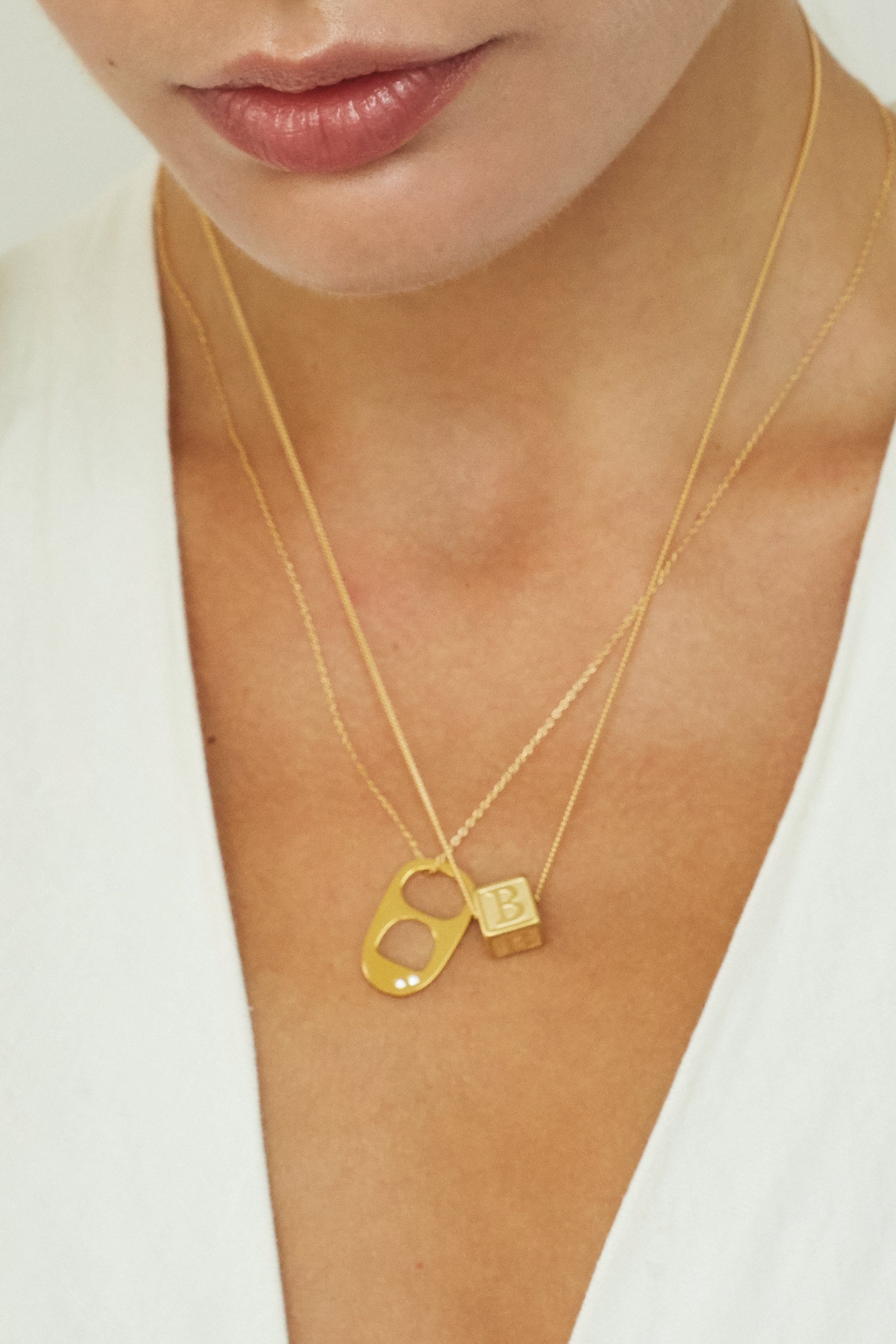 close up of model wearing "B" Letter Block letter on simple chain paired with soda tab charm on simple chain  Bagatiba 