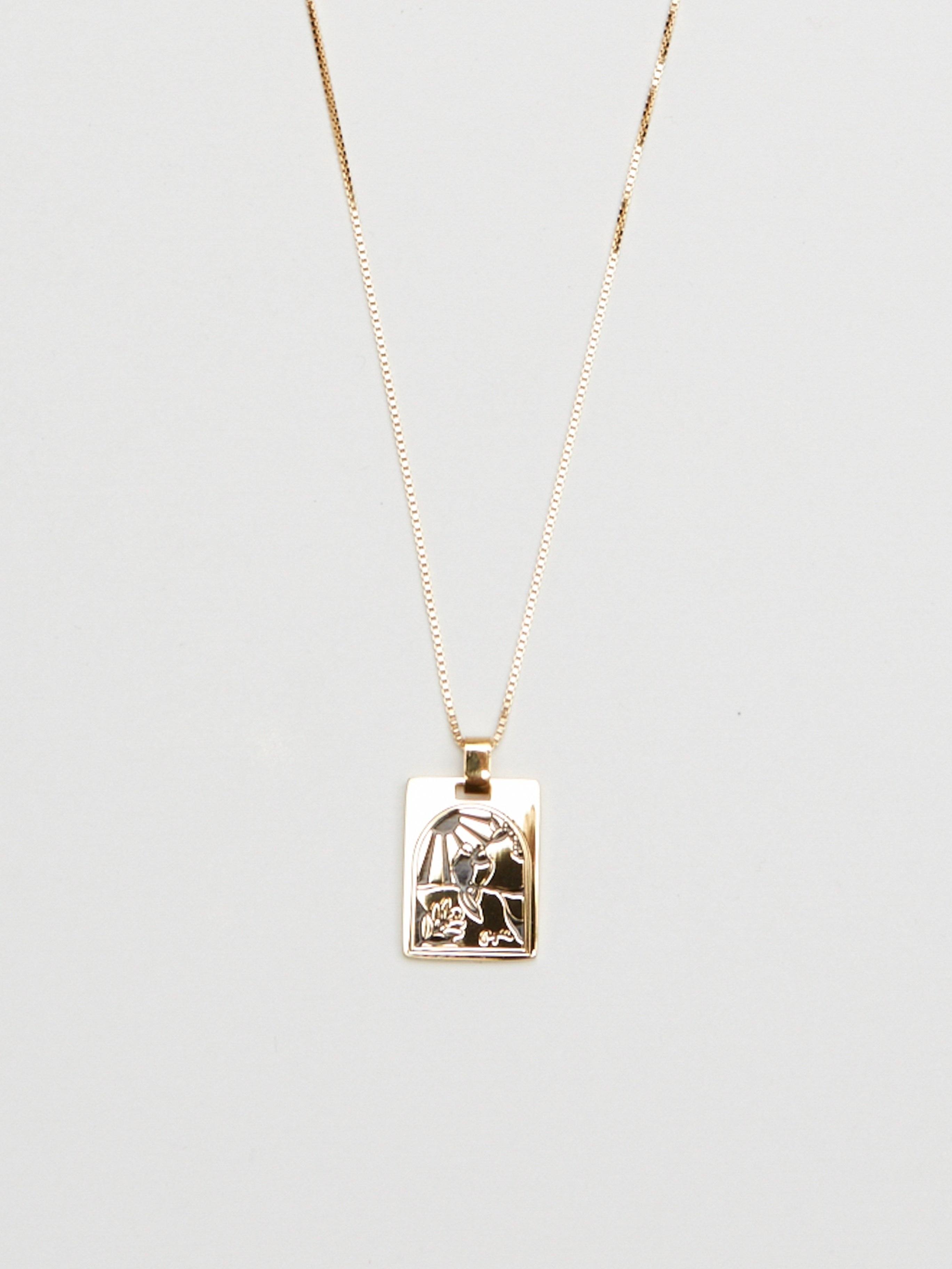 Cropped flat lay of Bagatiba Long Cage Necklace Necklace Bagatiba 
