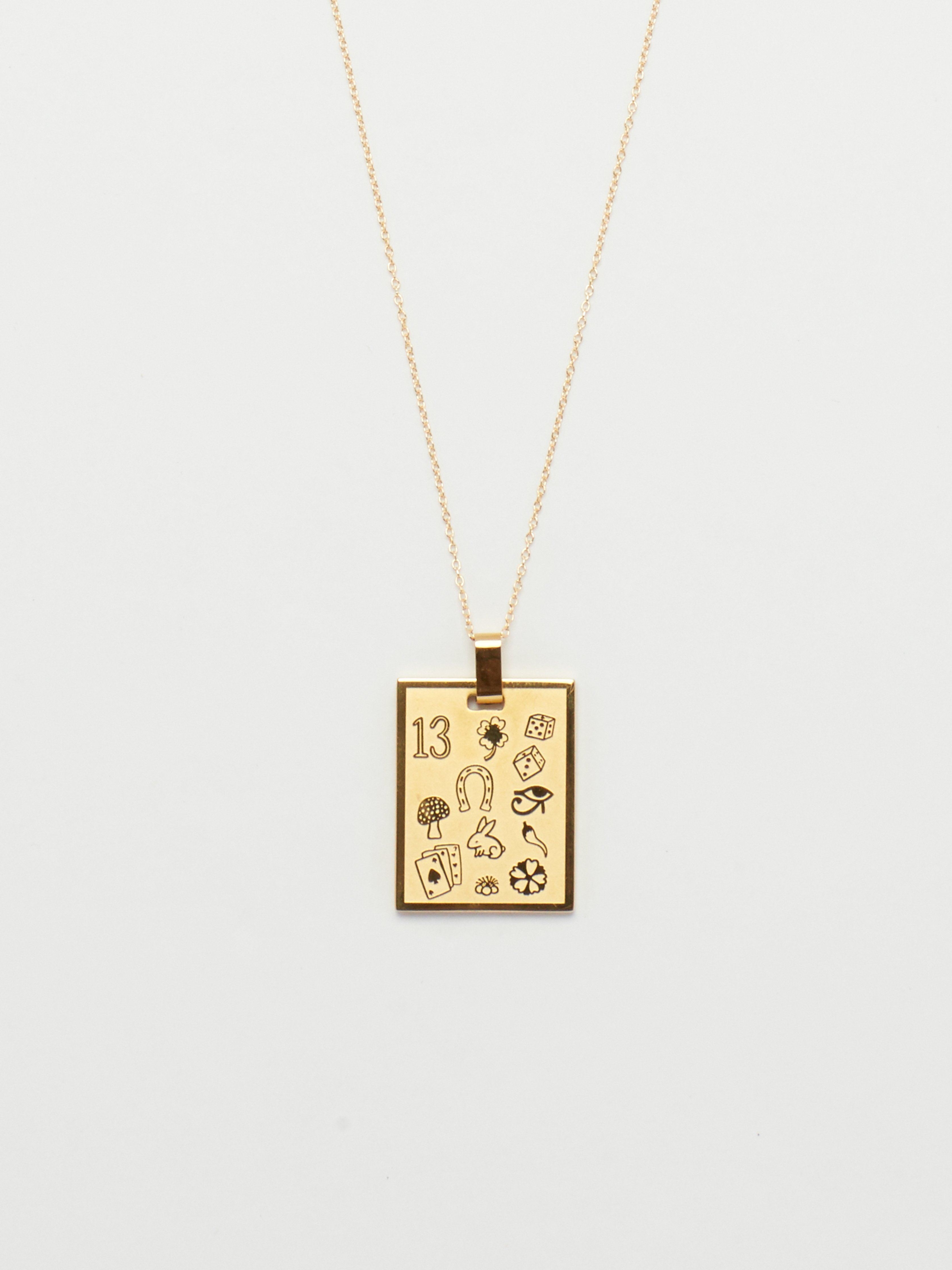 Cropped view flat lay of Bagatiba Lucky Charm Necklace  Bagatiba 
