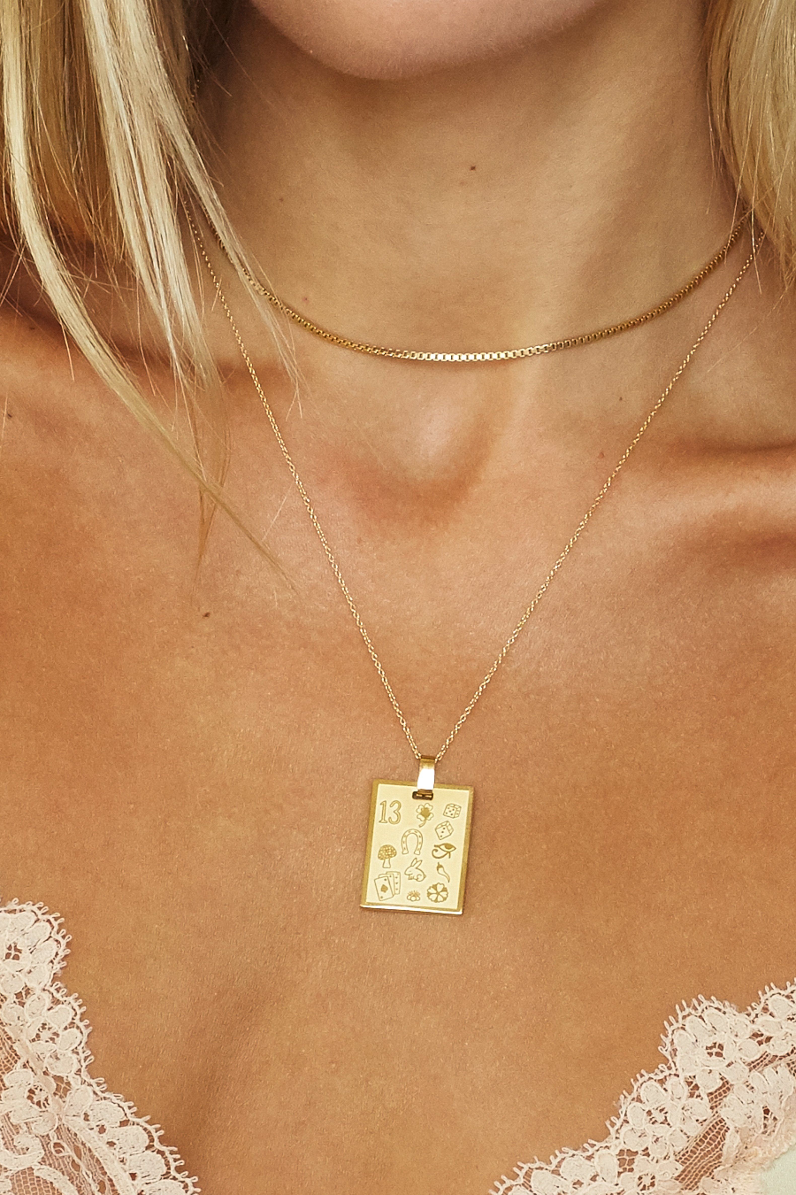 Cropped view on model of Bagatiba Lucky Charm Necklace paired with Vintage Square Choker Bagatiba 