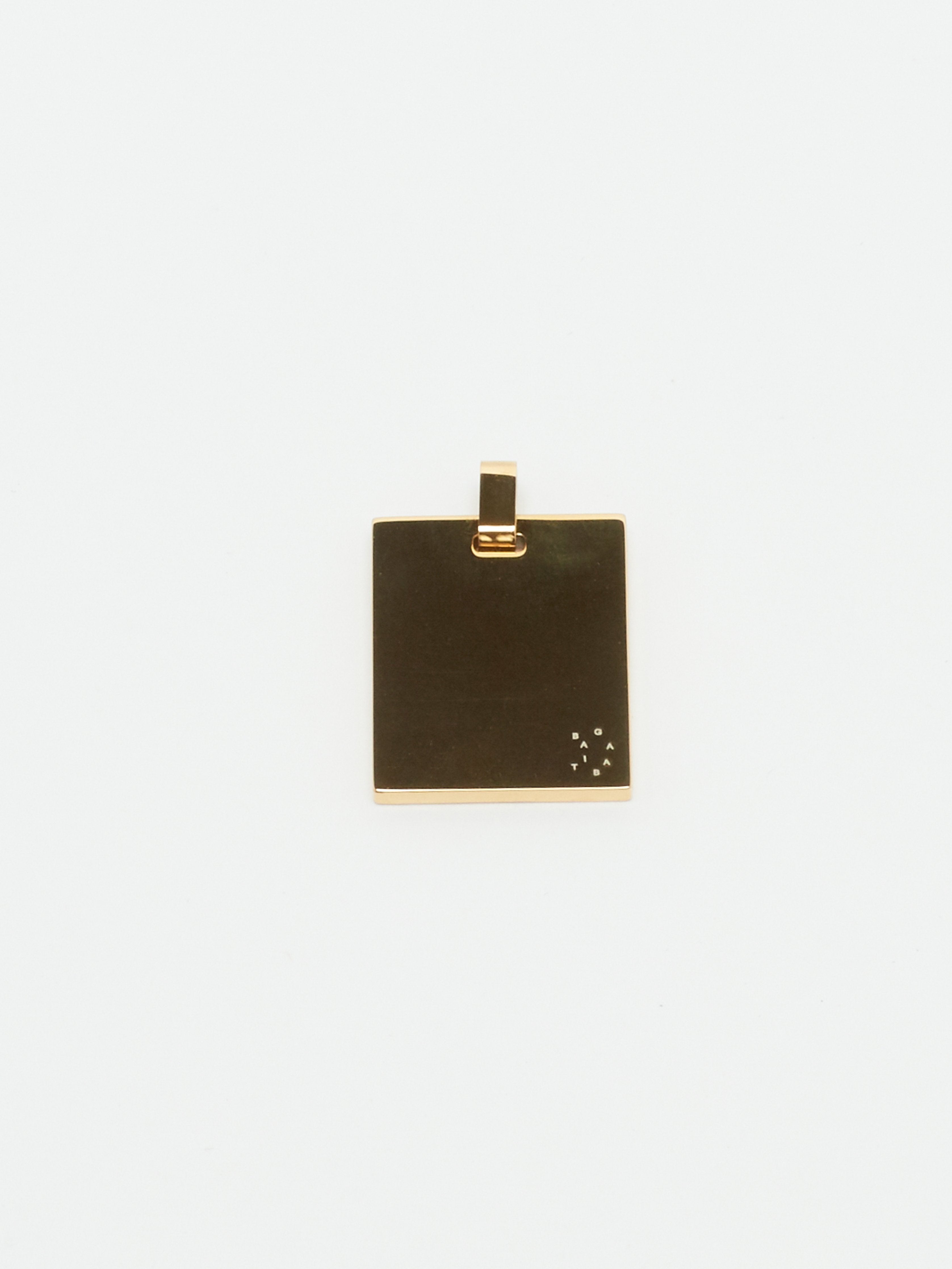 Detail view flat lay of reverse side Bagatiba Lucky Charm Necklace charm Bagatiba 