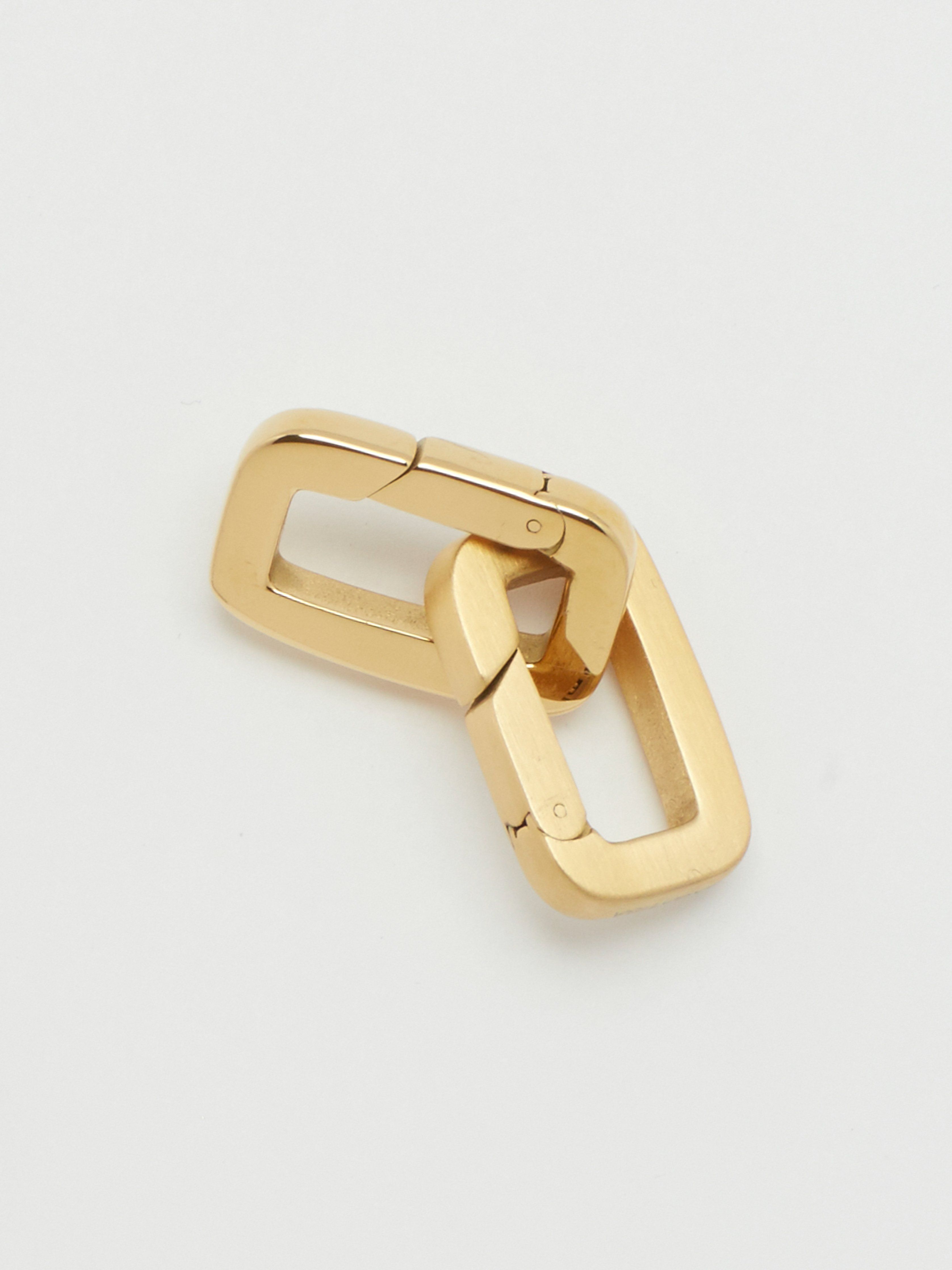 Detail flat lay view of Brushed Gold Cara Clip linked with Gold Cara Clip  Bagatiba 