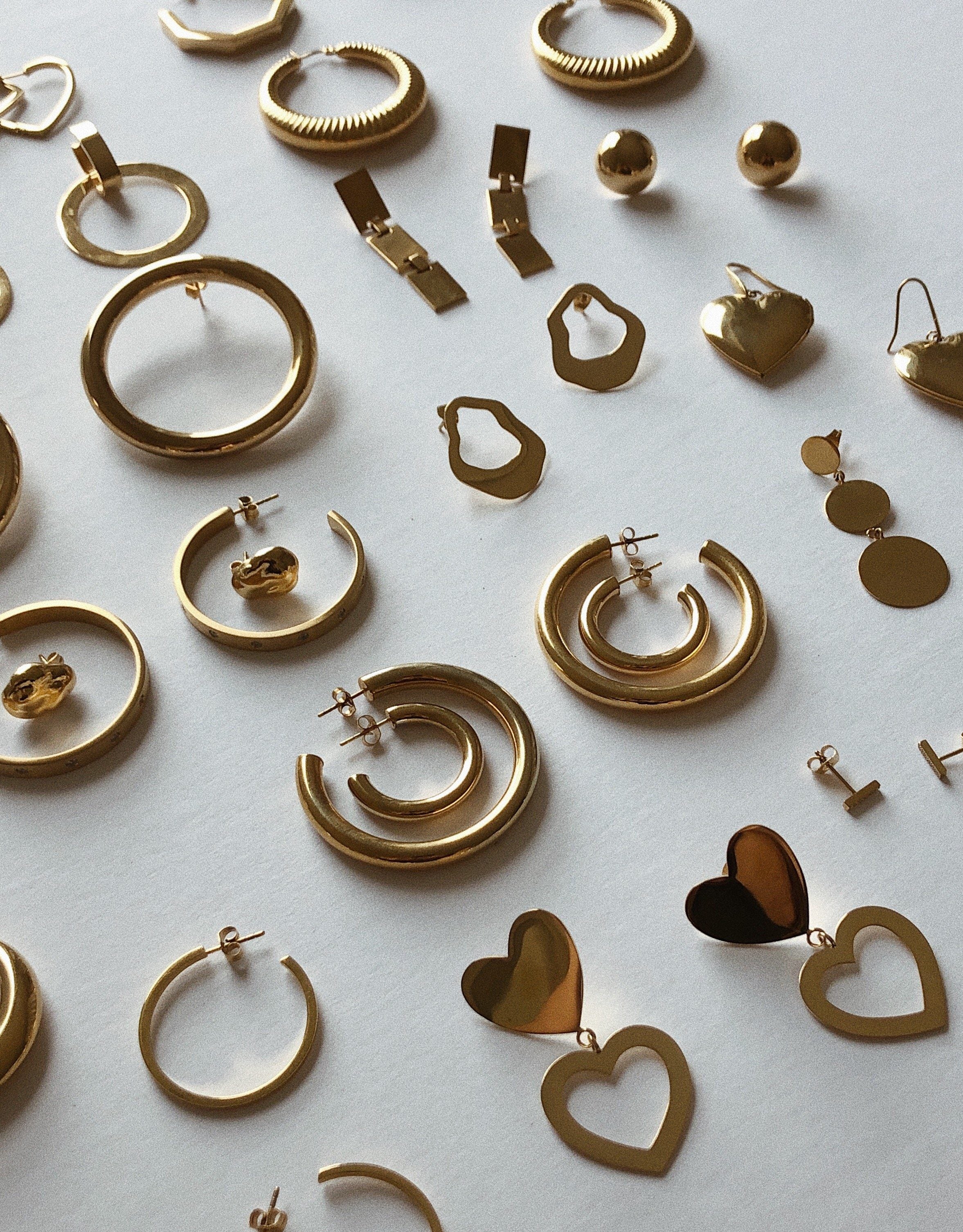 Flay lay view of Bagatiba earring collection including Button Studs Earrings Bagatiba 