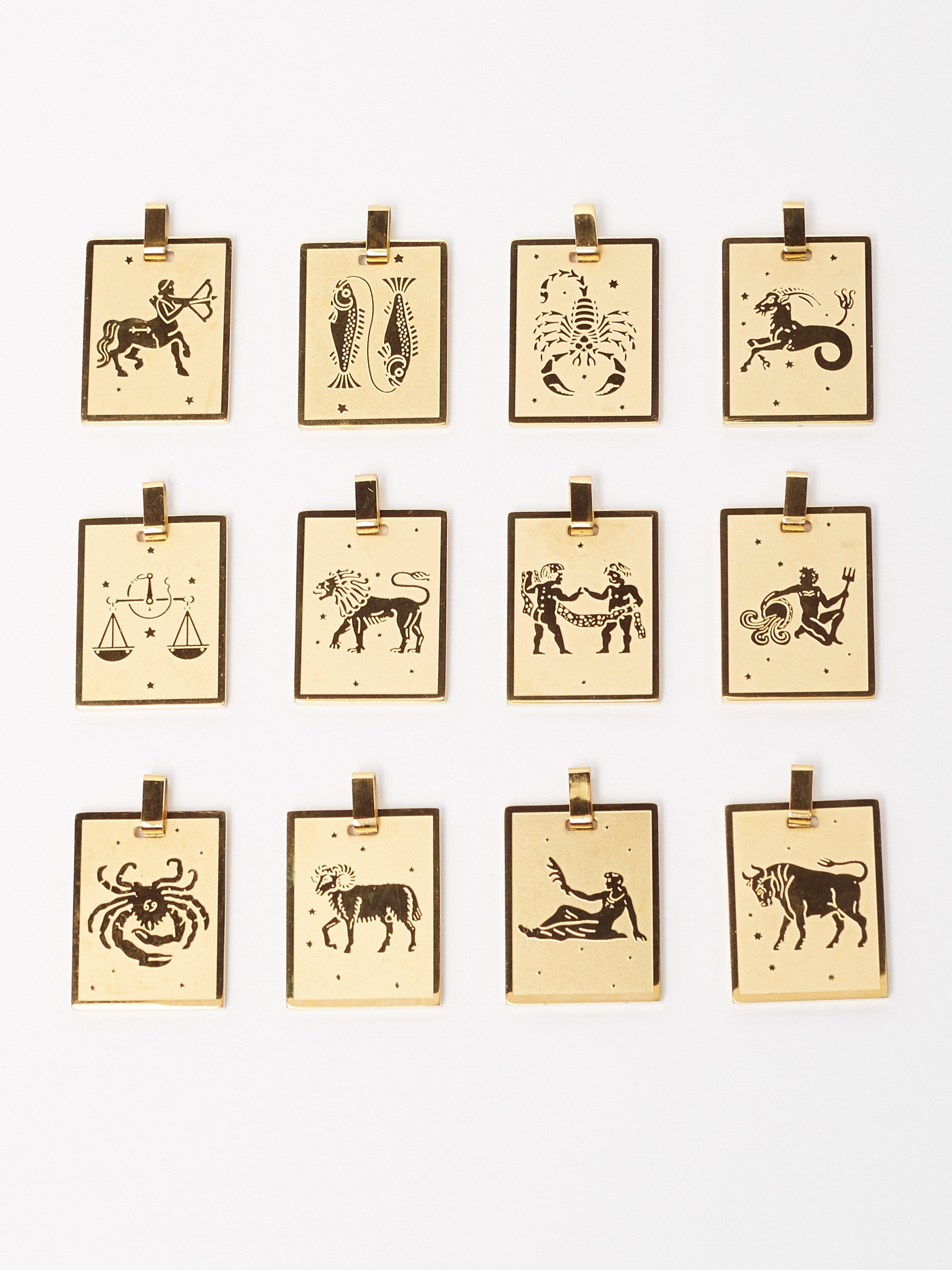 Full view flat lay of zodiac collection including the Capricorn Charm charm Bagatiba 