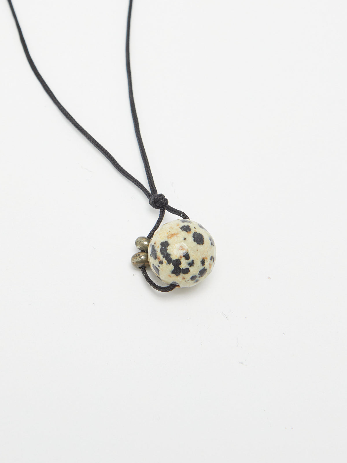 Dalmatian Drop Necklace necklace flat lay close up