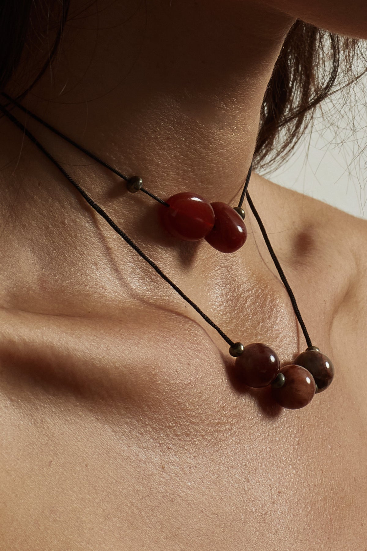 Double Red Agate Necklace necklace close up on skin