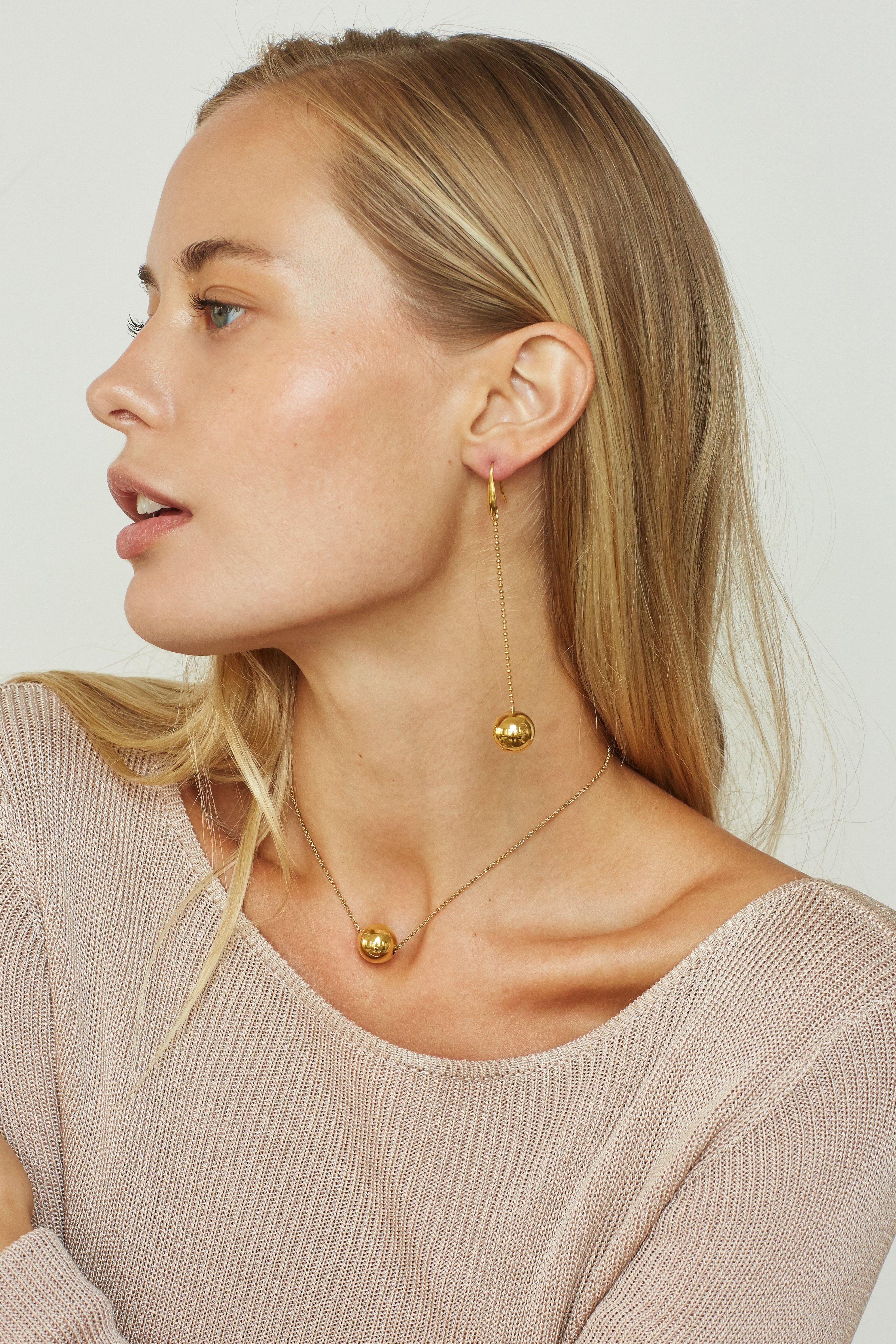 Model profile view wearing Drop Sphere Earrings Earrings bagatiba 