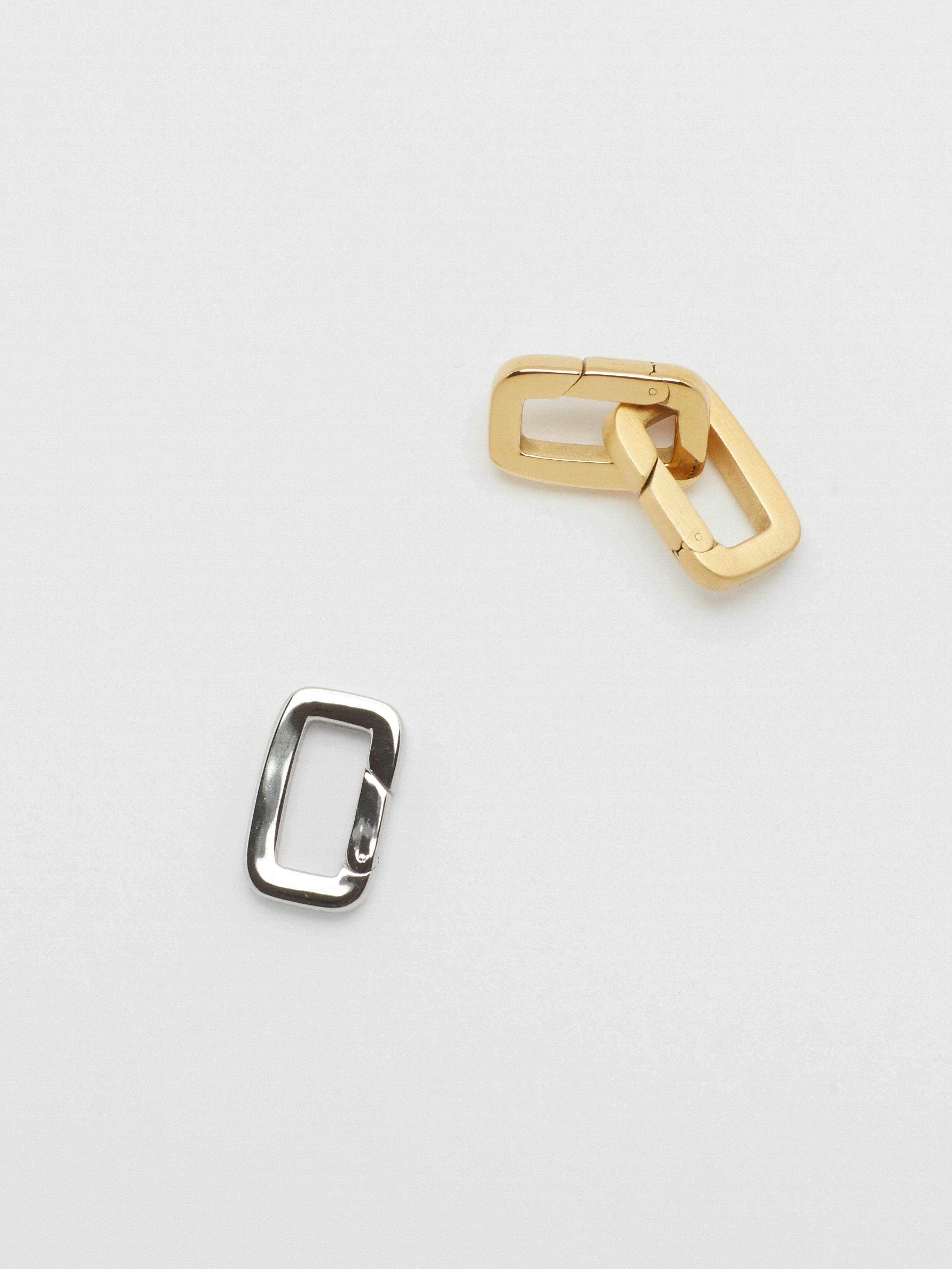 Full view flat lay of 2 Gold Cara Clips linked & 1 Silver Cara Clip Bagatiba 