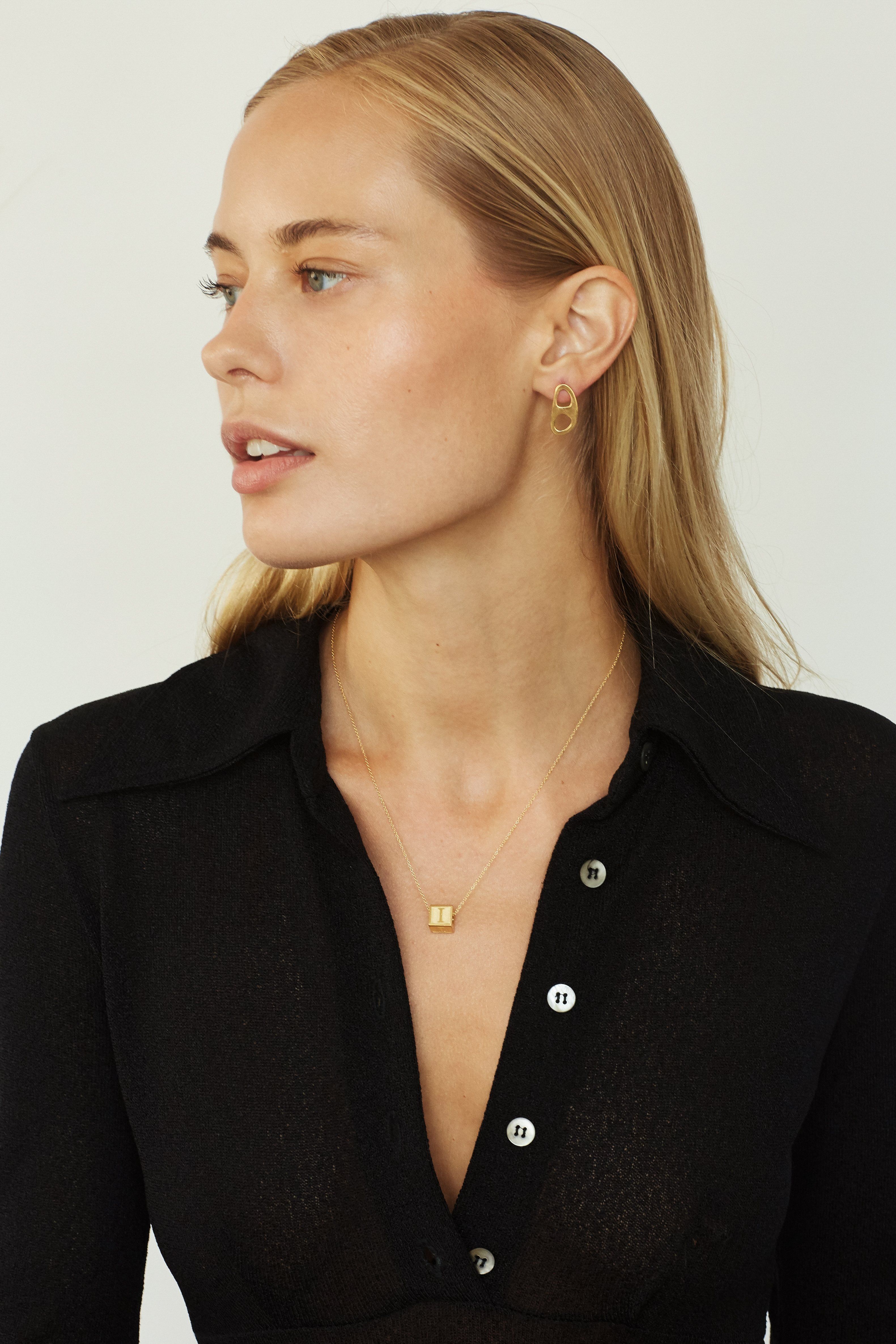 Model wearing "I" Letter Block letters and gold tab studs  Bagatiba 