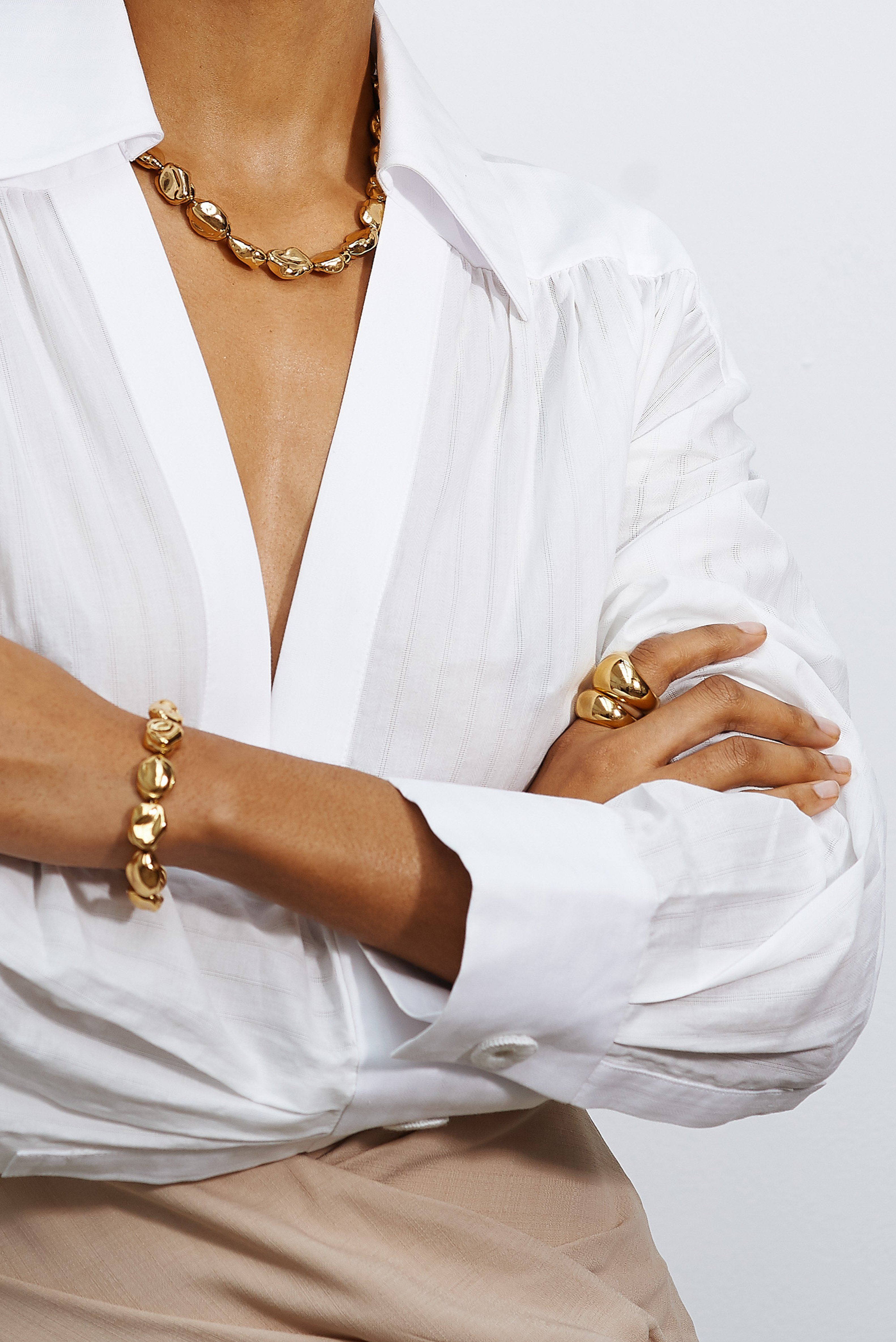 Cropped detail view on model of Large Gold Orb Ring Ring bagatiba 