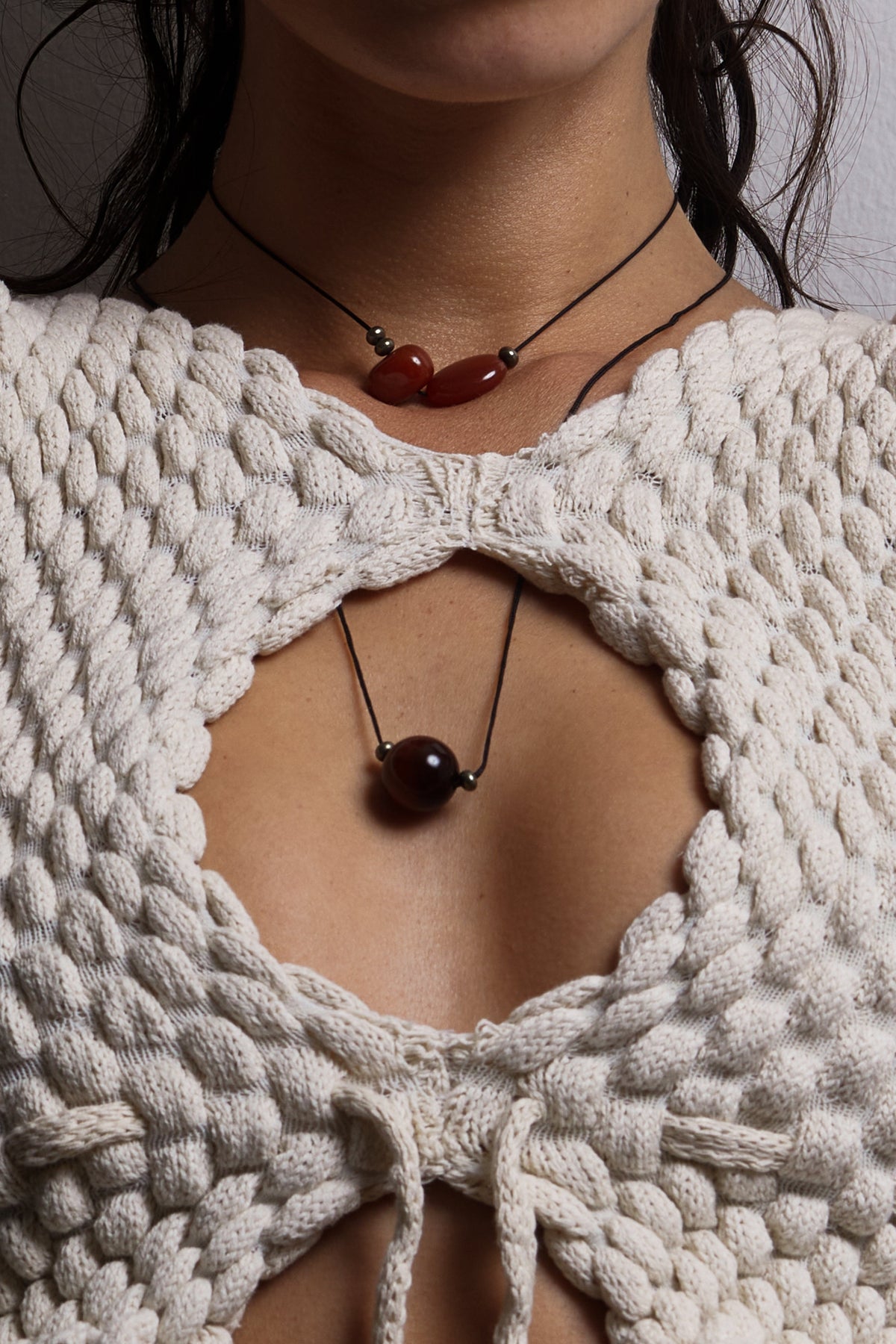 Red Tiger Eye Necklace necklace Bagatiba close up on model wearing white knit top