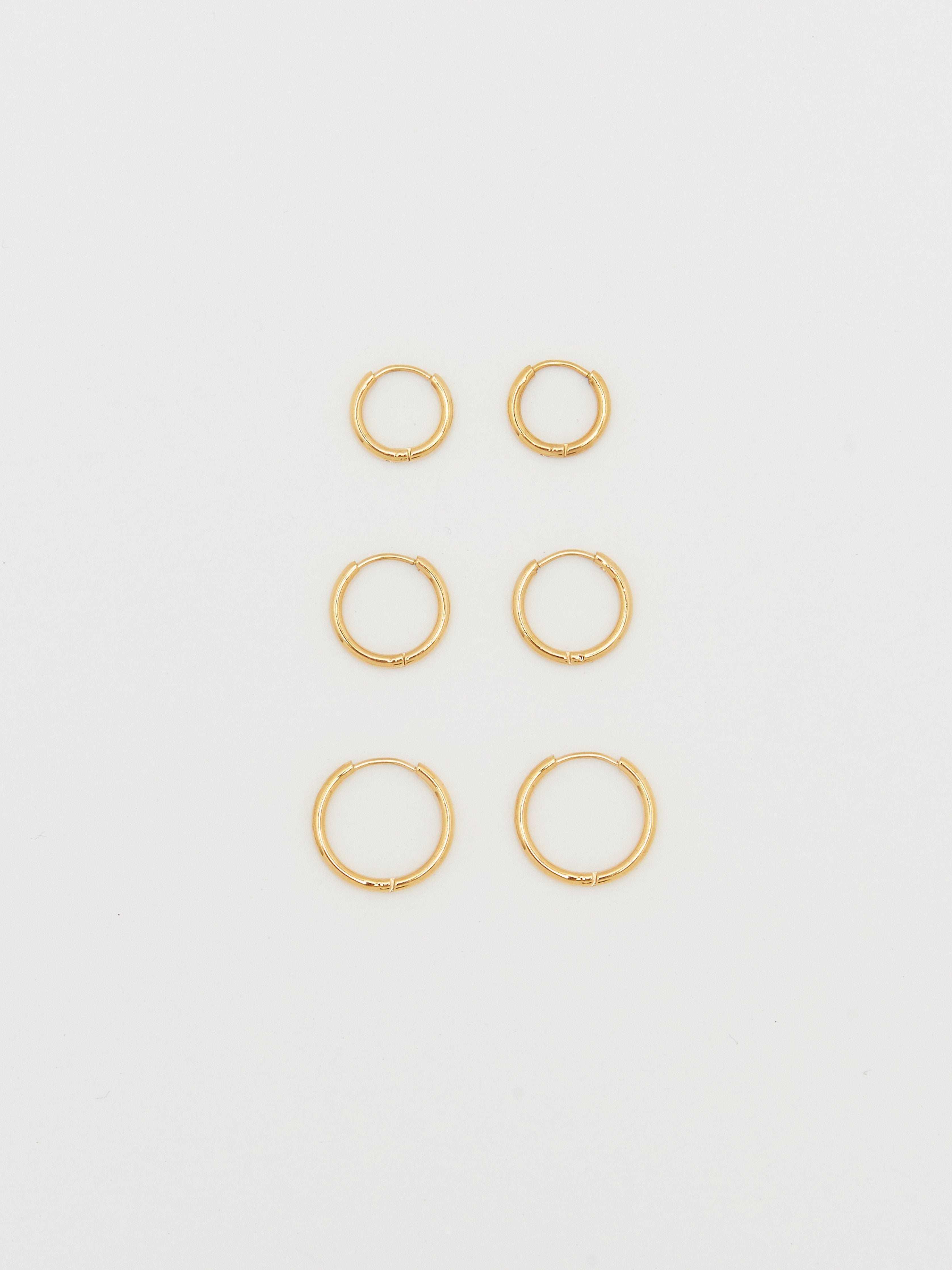 Full view flat lay Set of Gold Eco Huggies Earrings Bagatiba 